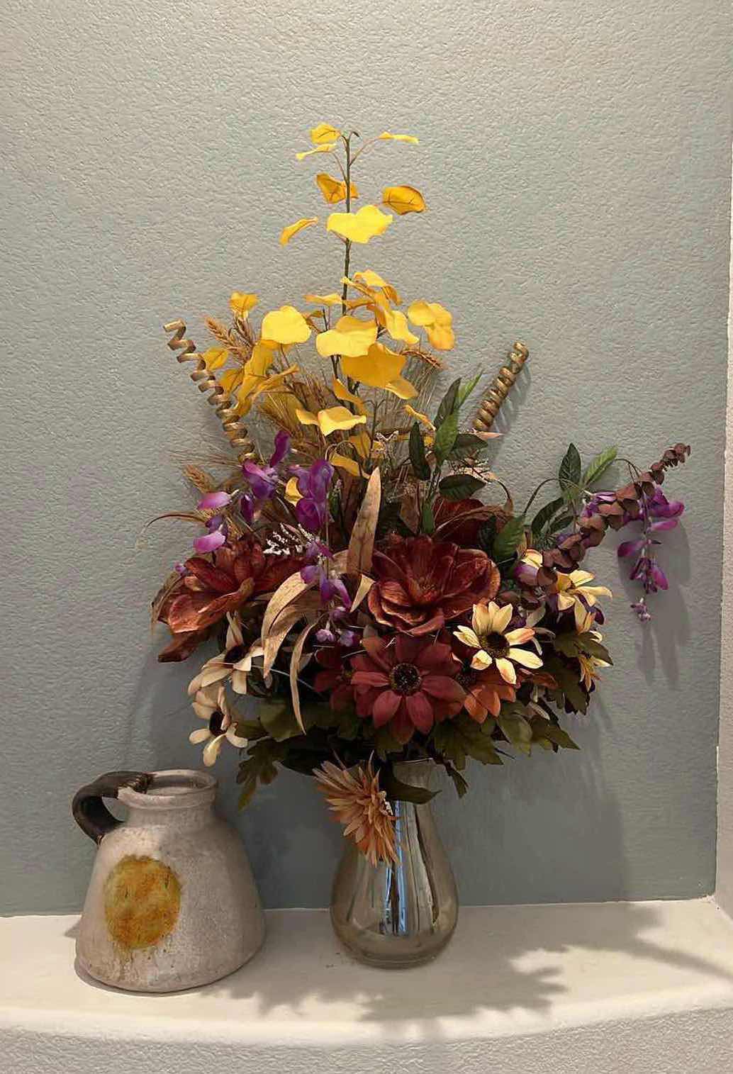 Photo 1 of FAUX FLORAL FALL ARRANGEMENT IN AMBER GLASS VASE H36", CERAMIC POTTERY JUG W ORANGE DESIGN H9"