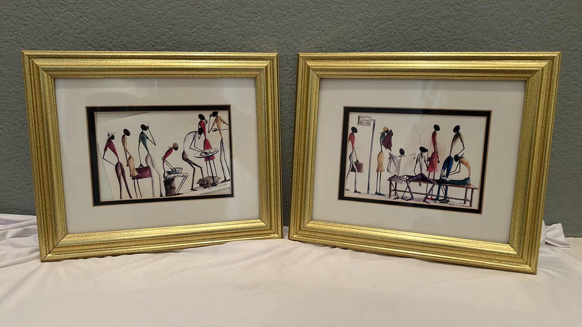 Photo 1 of 2-GOLD FRAMED "AFRICAN STICK FIGURES" SIGNED ARTWORKS 12" x 10"