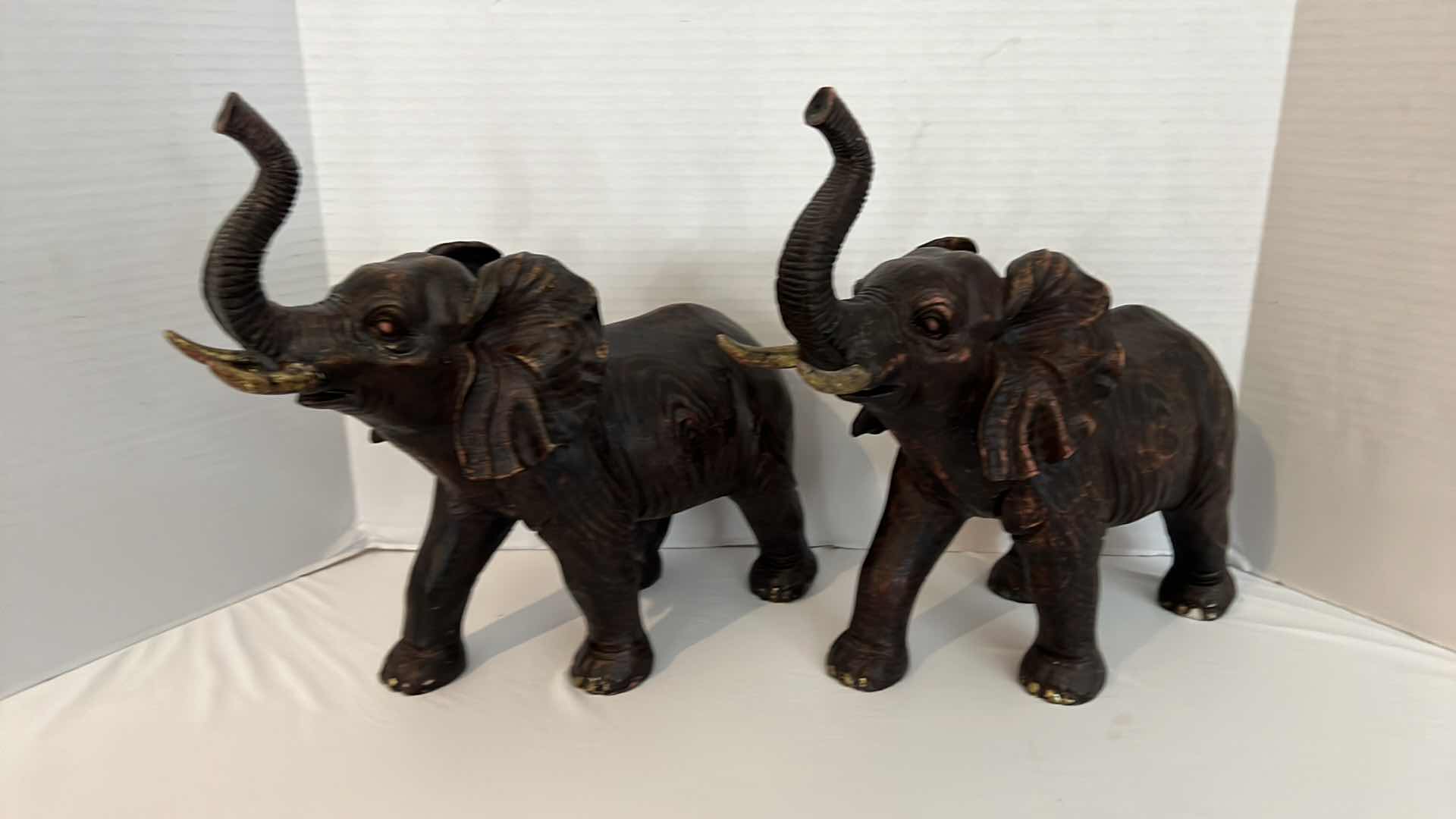 Photo 1 of 2-BLACK W COPPER RESIN ELEPHANT FIGURES W15" H13"