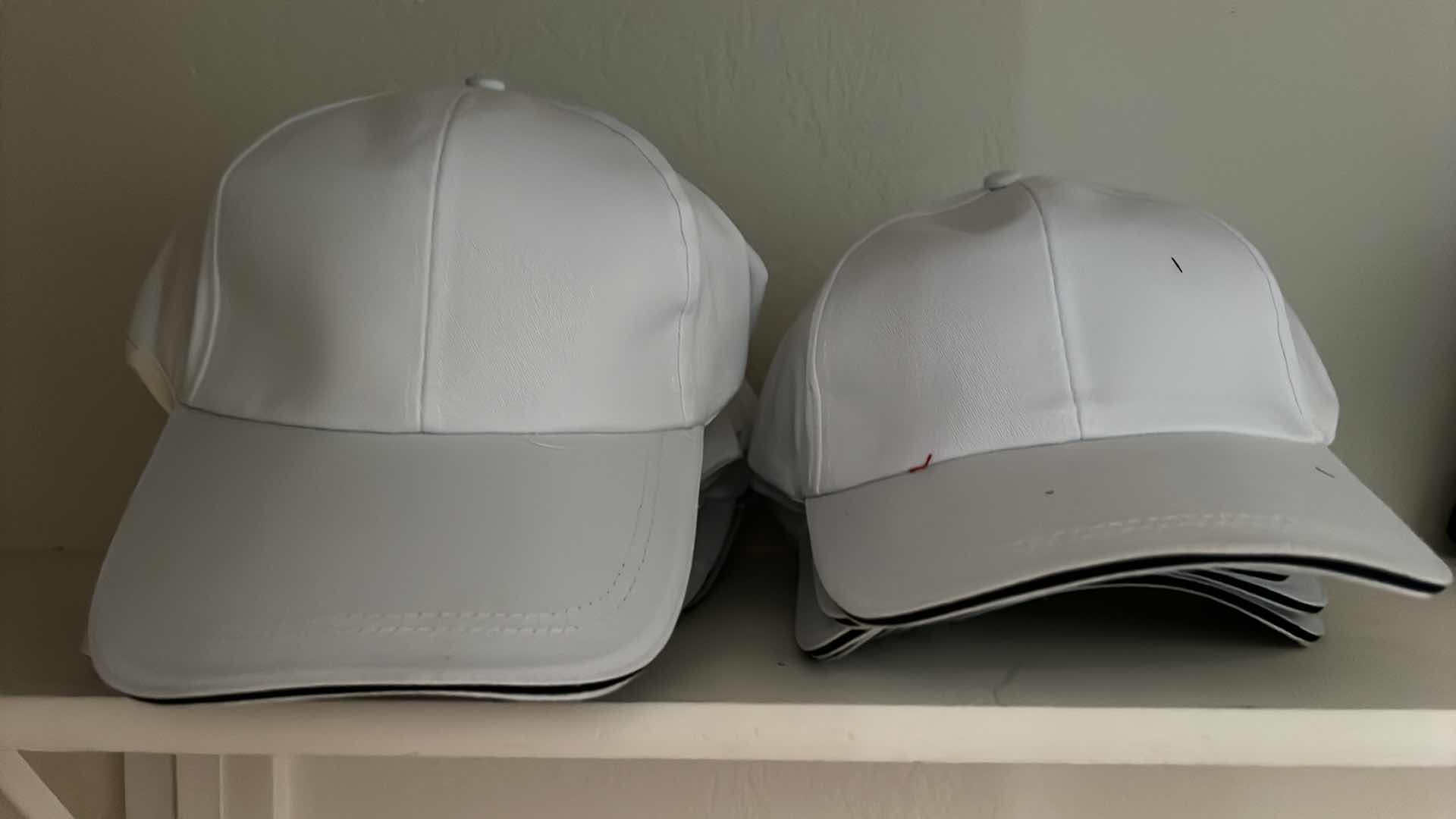 Photo 1 of BRAND NEW WHITE BASEBALL CAPS