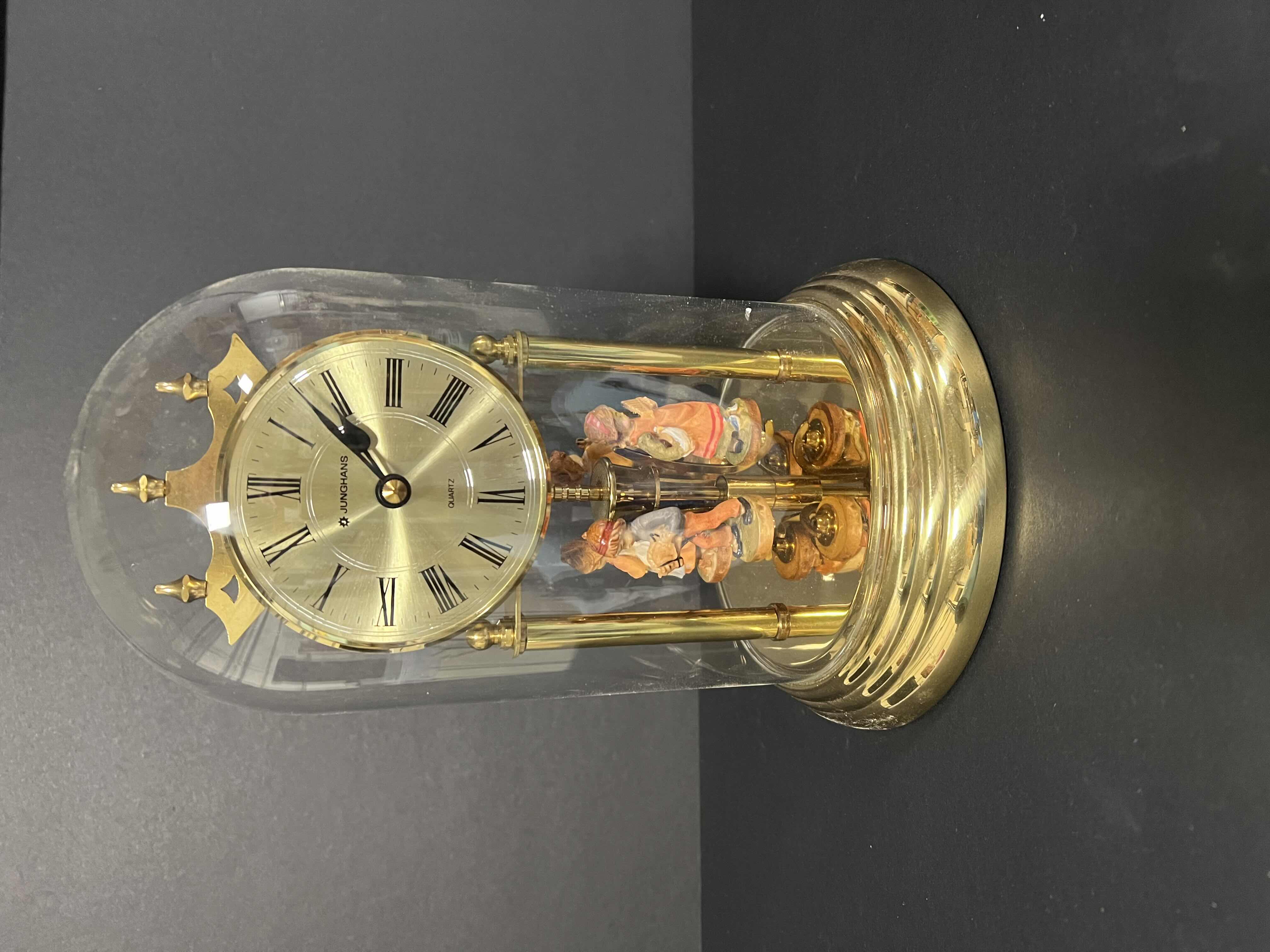 Photo 1 of JUNGHANS QUARTZ GLASS DOME DESK CLOCK. GERMAN CHILDREN ROTATING STATUES. 9”H.