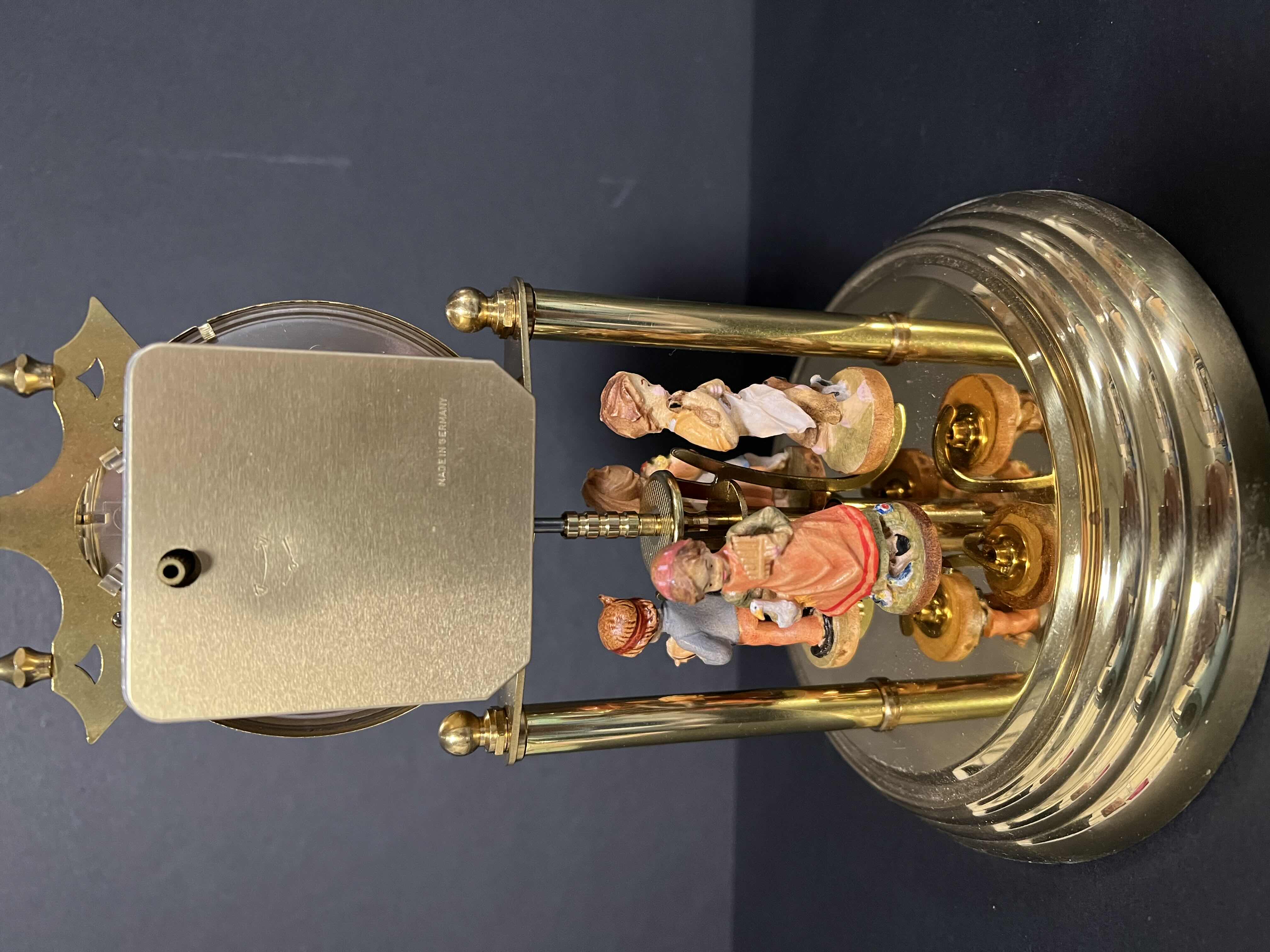 Photo 2 of JUNGHANS QUARTZ GLASS DOME DESK CLOCK. GERMAN CHILDREN ROTATING STATUES. 9”H.