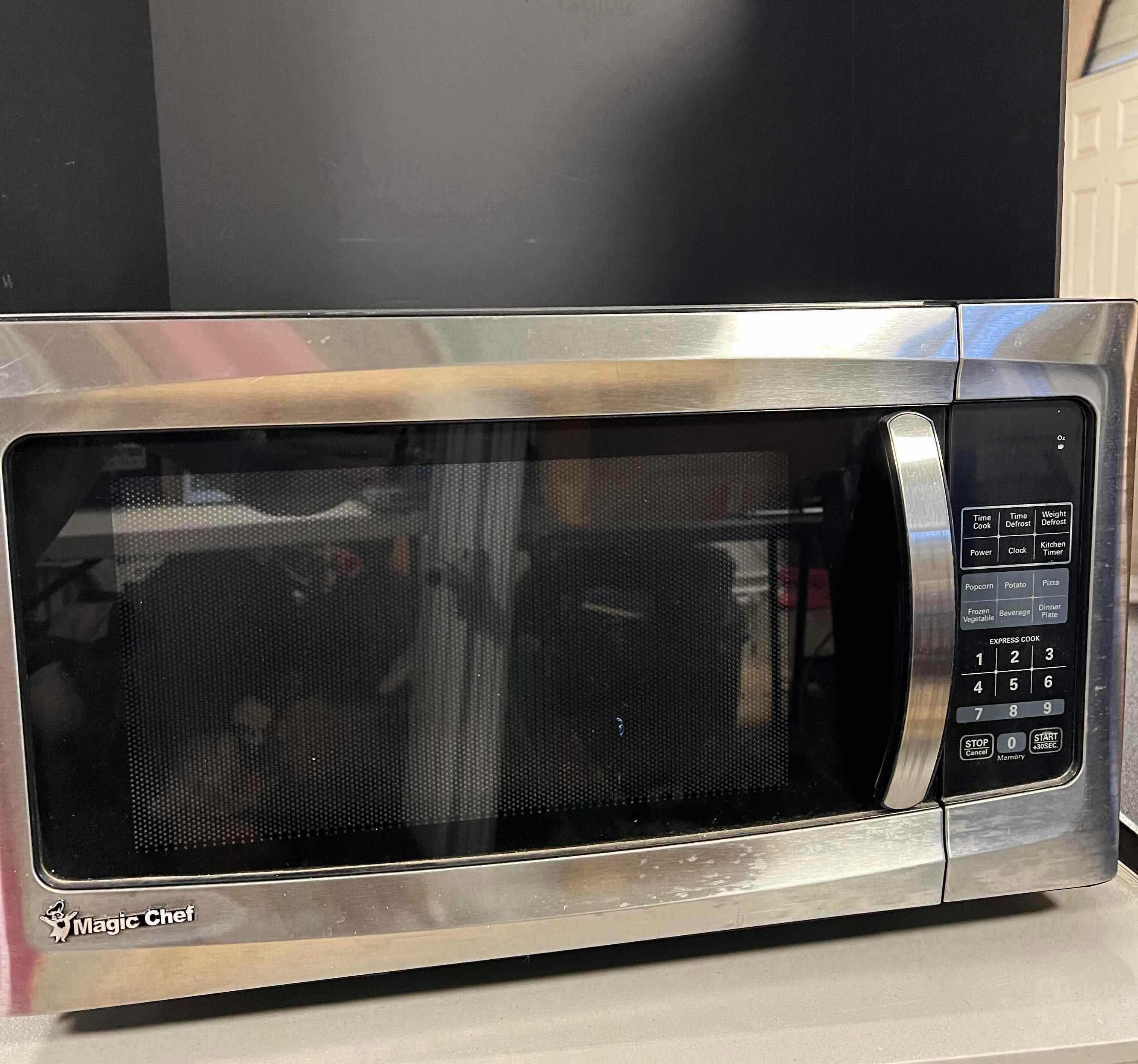 Photo 1 of COUNTER TOP STAINLESS STEEL MICROWAVE BY MAGIC CHEF. 1.6'CU FT 2500WATT