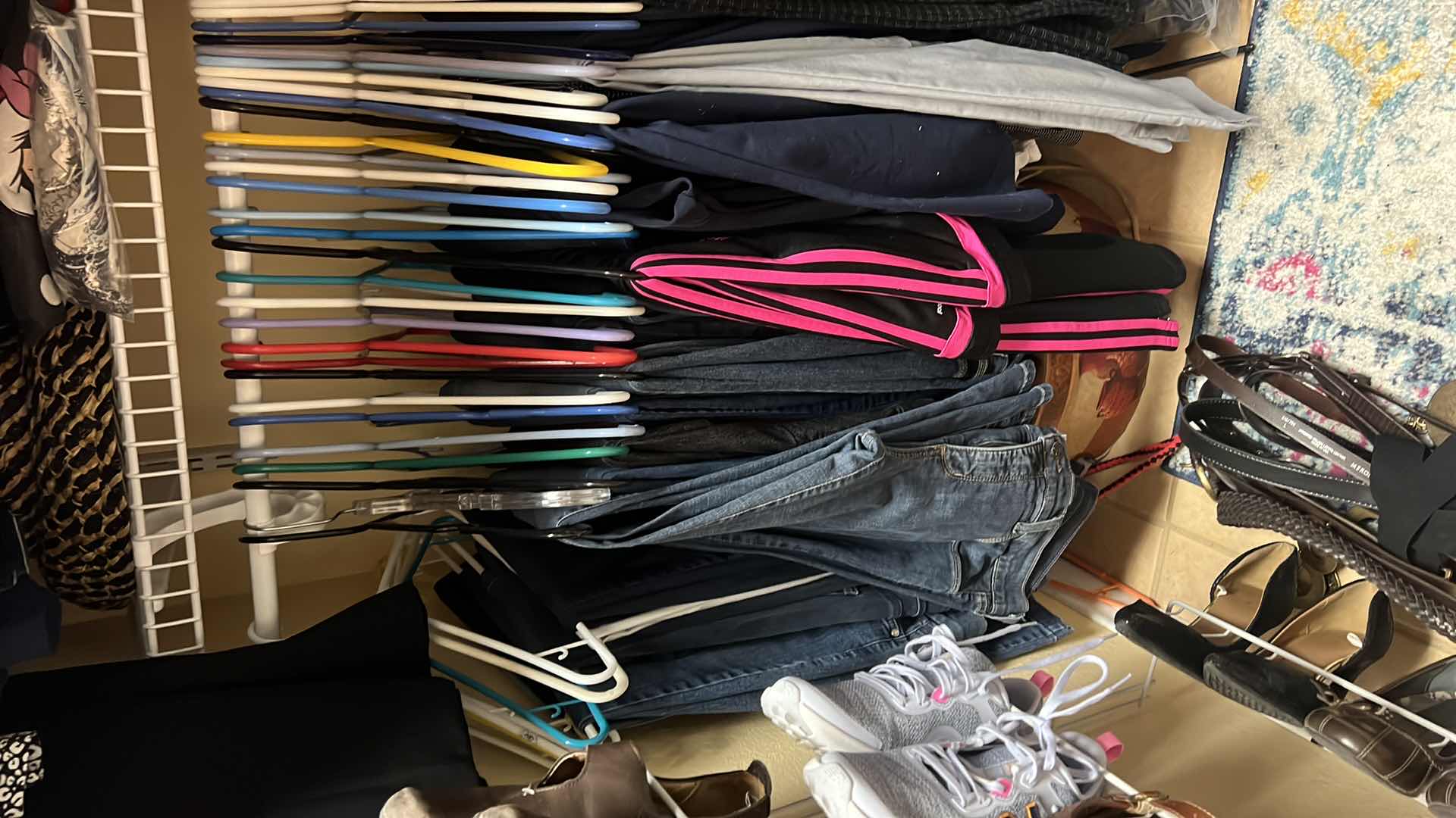 Photo 2 of CONTENTS OF PRIMARY CLOSET RACK-WOMEN'S CLOTHES (PANT APPROX SIZE 12-14)