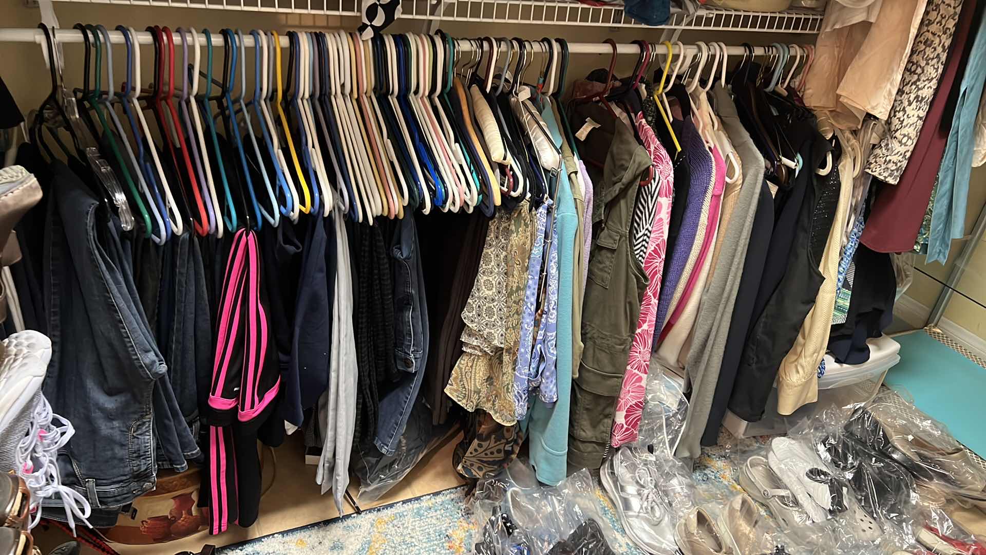 Photo 1 of CONTENTS OF PRIMARY CLOSET RACK-WOMEN'S CLOTHES (PANT APPROX SIZE 12-14)