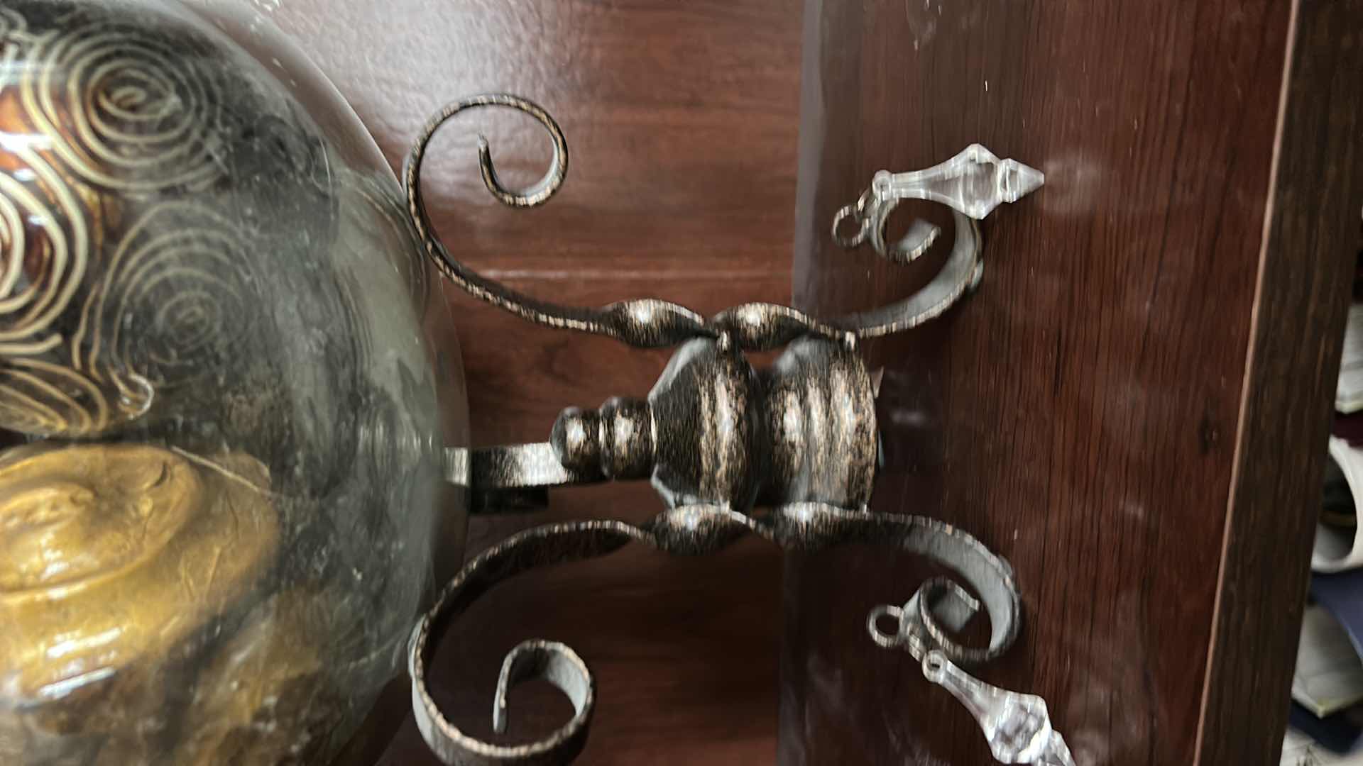 Photo 1 of IRON SCROLL STAND W GLASS BOWL FILLED W DECOR BALLS H12”