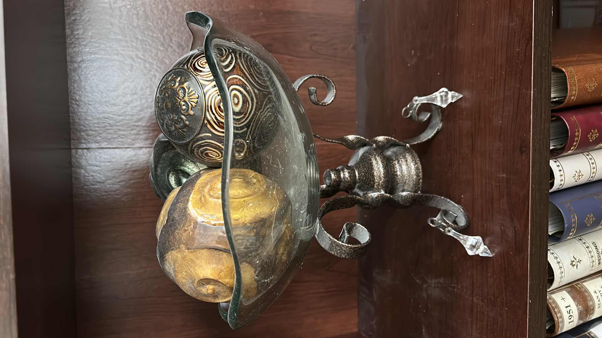 Photo 1 of IRON SCROLL STAND W GLASS BOWL FILLED W DECOR BALLS H12”