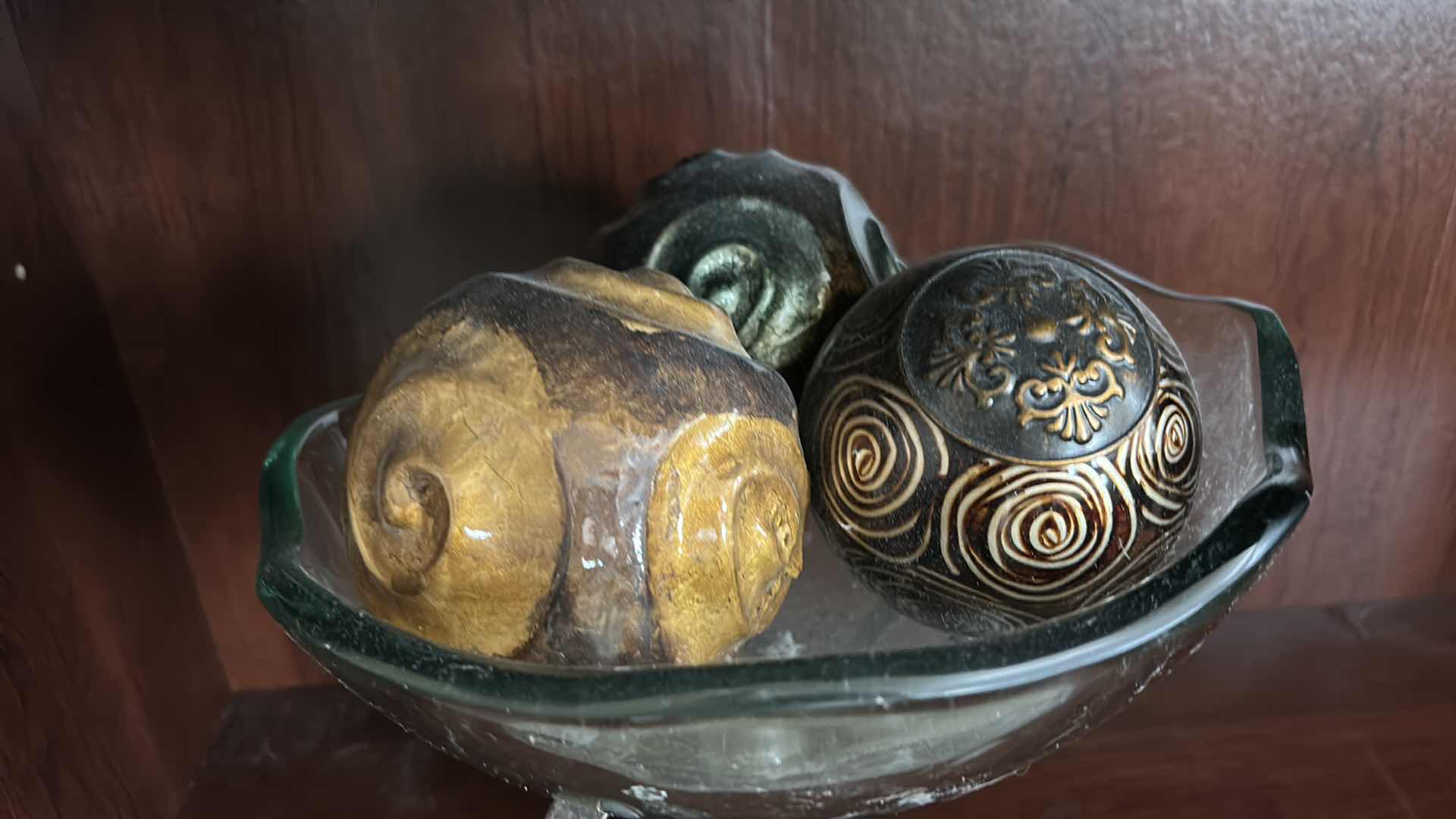 Photo 1 of IRON SCROLL STAND W GLASS BOWL FILLED W DECOR BALLS H12”
