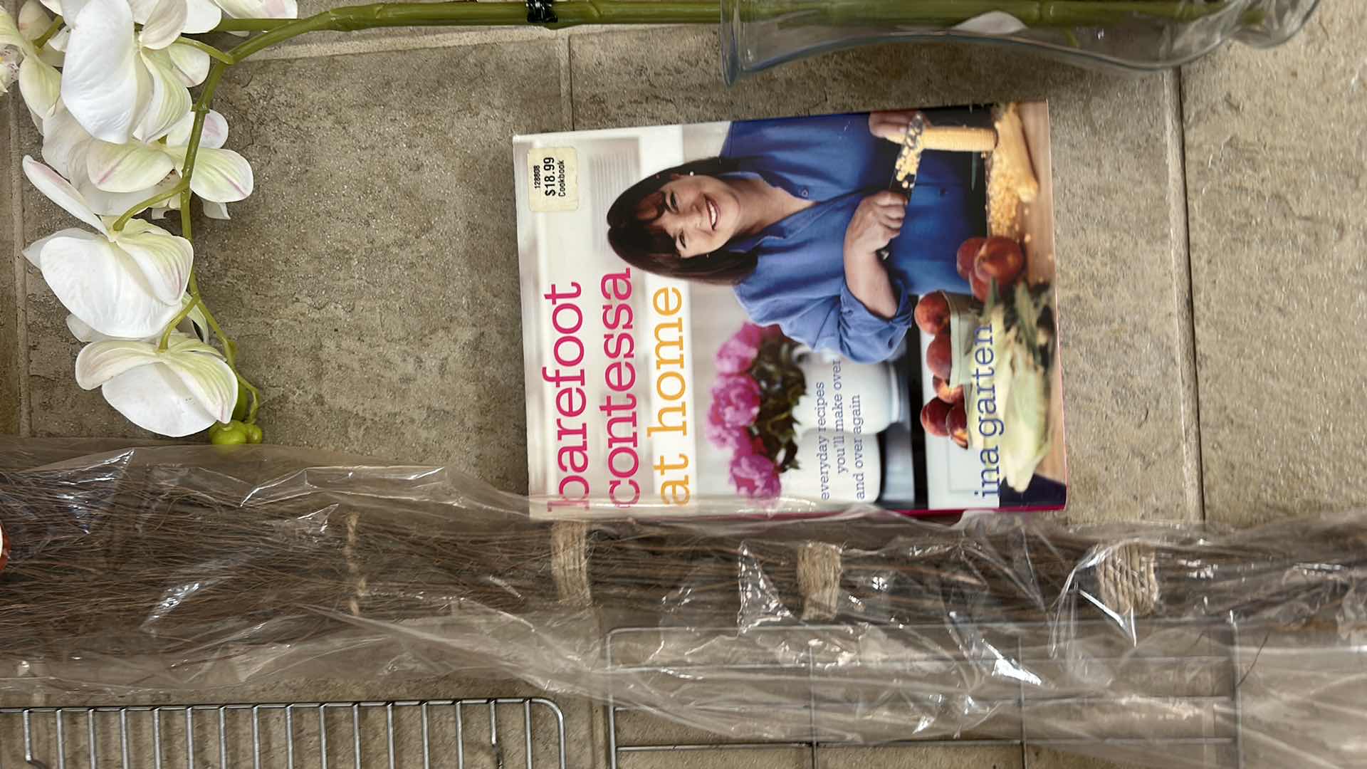 Photo 1 of HOUSEHOLD ASSORTMENT- WIRE RACKS, CINNAMON BROOM, HARDCOVER BOOK, FAUX ORCHID IN GLASS VASE