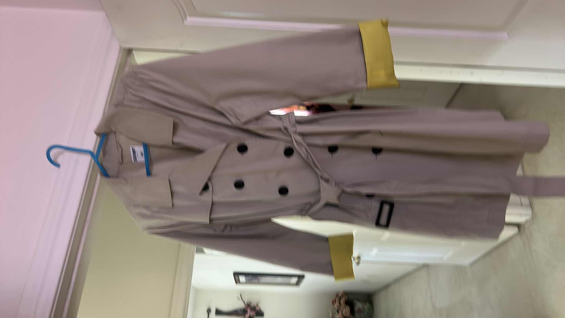 Photo 1 of WOMENSWEAR- 2 WOMENS RAINCOATS SIZE SM AND LARGE