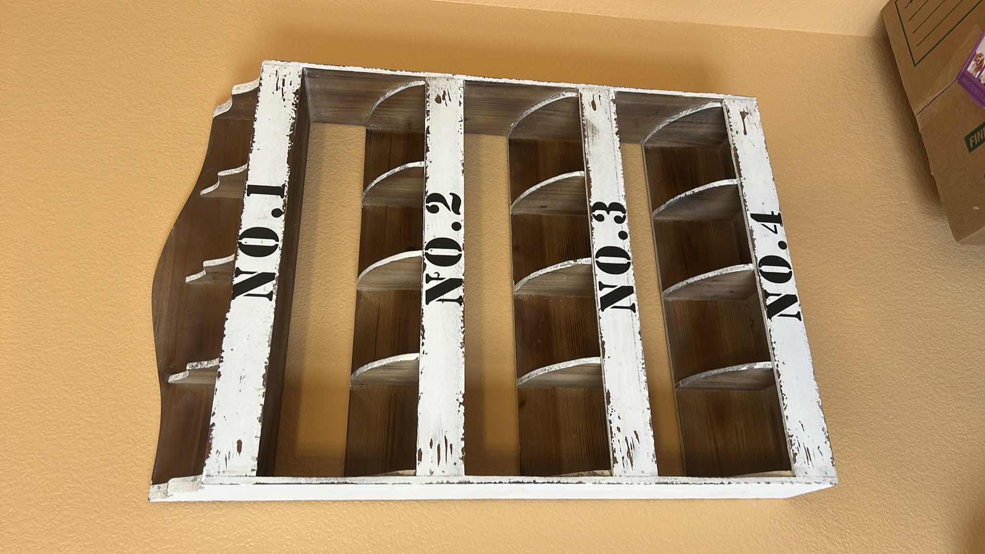 Photo 1 of DISTRESSED WHITE WOODEN WALL ORGANIZER WITH NUMBERED COMPARTMENTS. 22“ x 5“ x H34“.