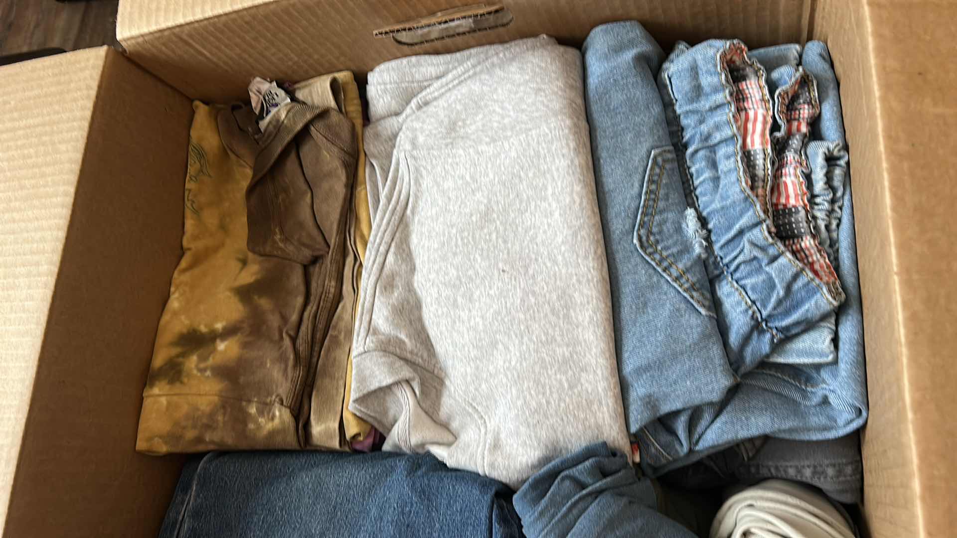 Photo 1 of BOX OF WOMENS CLOTHING, BLOUSES, SHIRTS AND PANTS (ASSORTED SIZES)