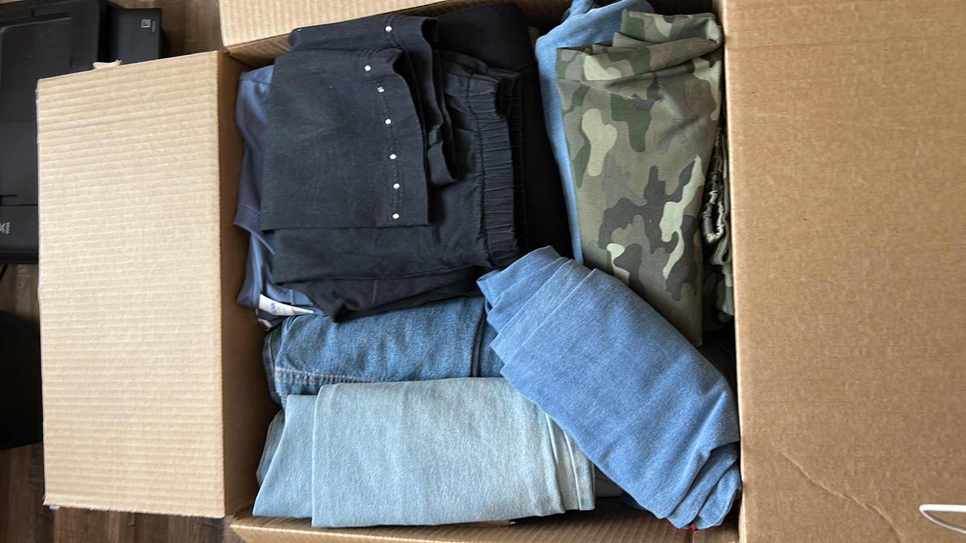 Photo 1 of BOX OF WOMENS CLOTHING, BLOUSES, SHIRTS AND PANTS (ASSORTED SIZES)