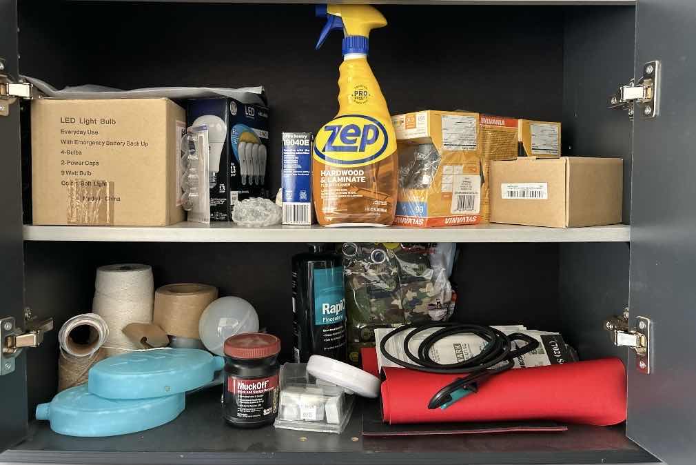 Photo 1 of CONTENTS OF CABINET IN GARAGE