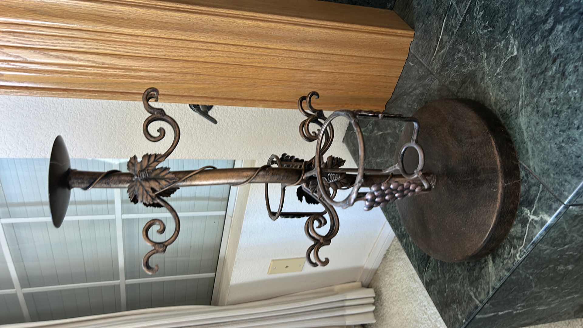 Photo 1 of METAL CANDLE HOLDER AND WINE BOTTLE STAND H23”