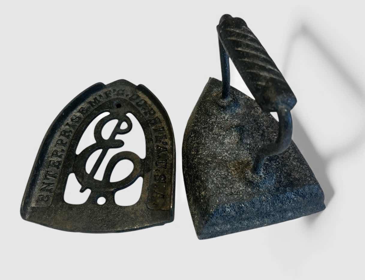Photo 1 of ANTIQUE SAD IRON AND MATCHING TRIVET