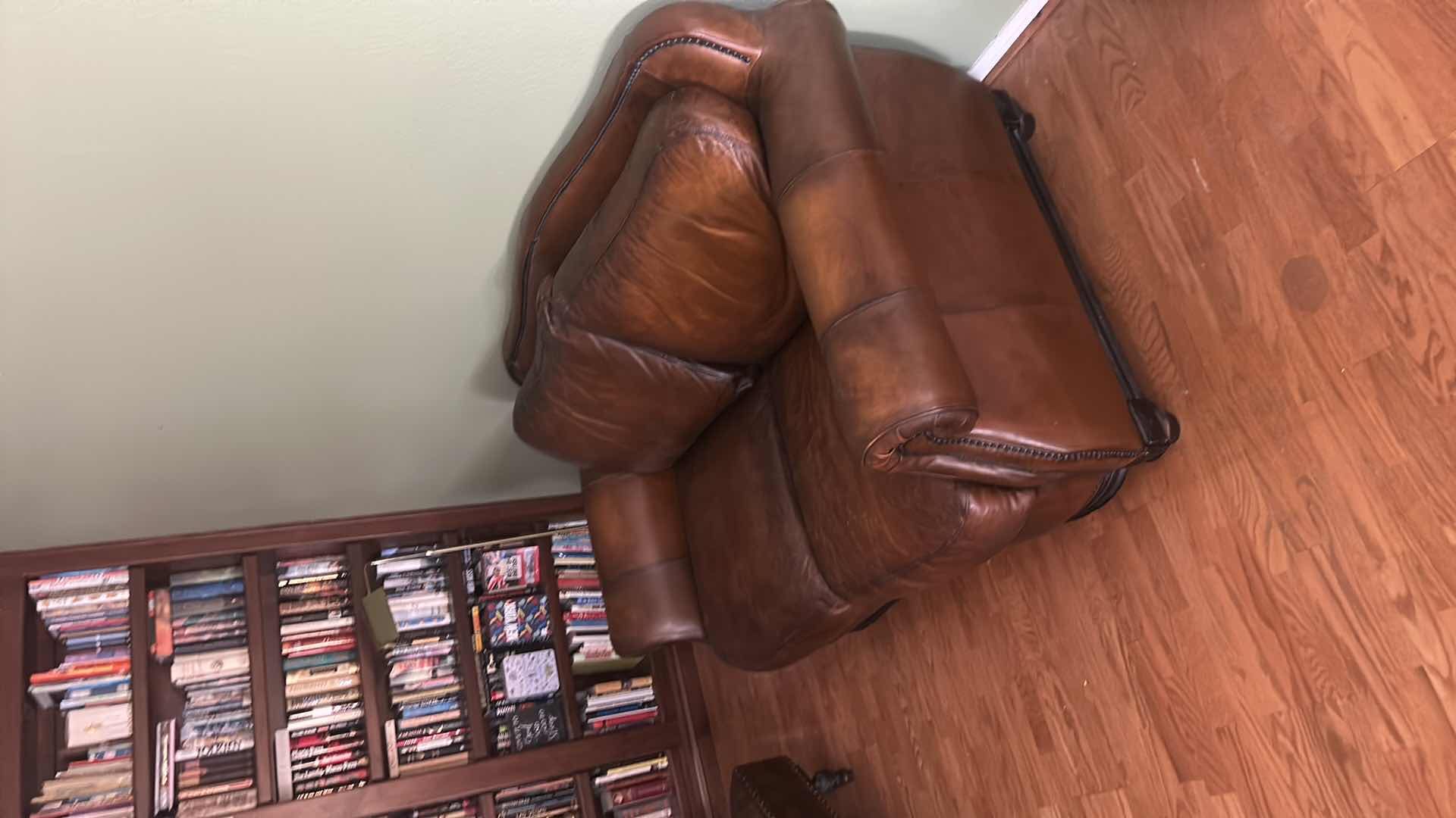 Photo 1 of BROWN LEATHER LOVESEAT WITH NAIL HEAD TRIM AND WOOD BASE & LEGS  69“ x 39“ x H36“