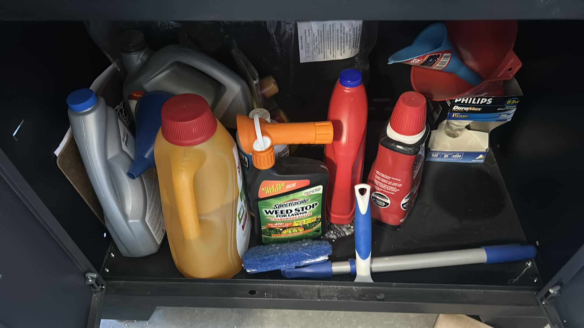 Photo 1 of CLEANING SUPPLIES ON SHELVES IN CABINET