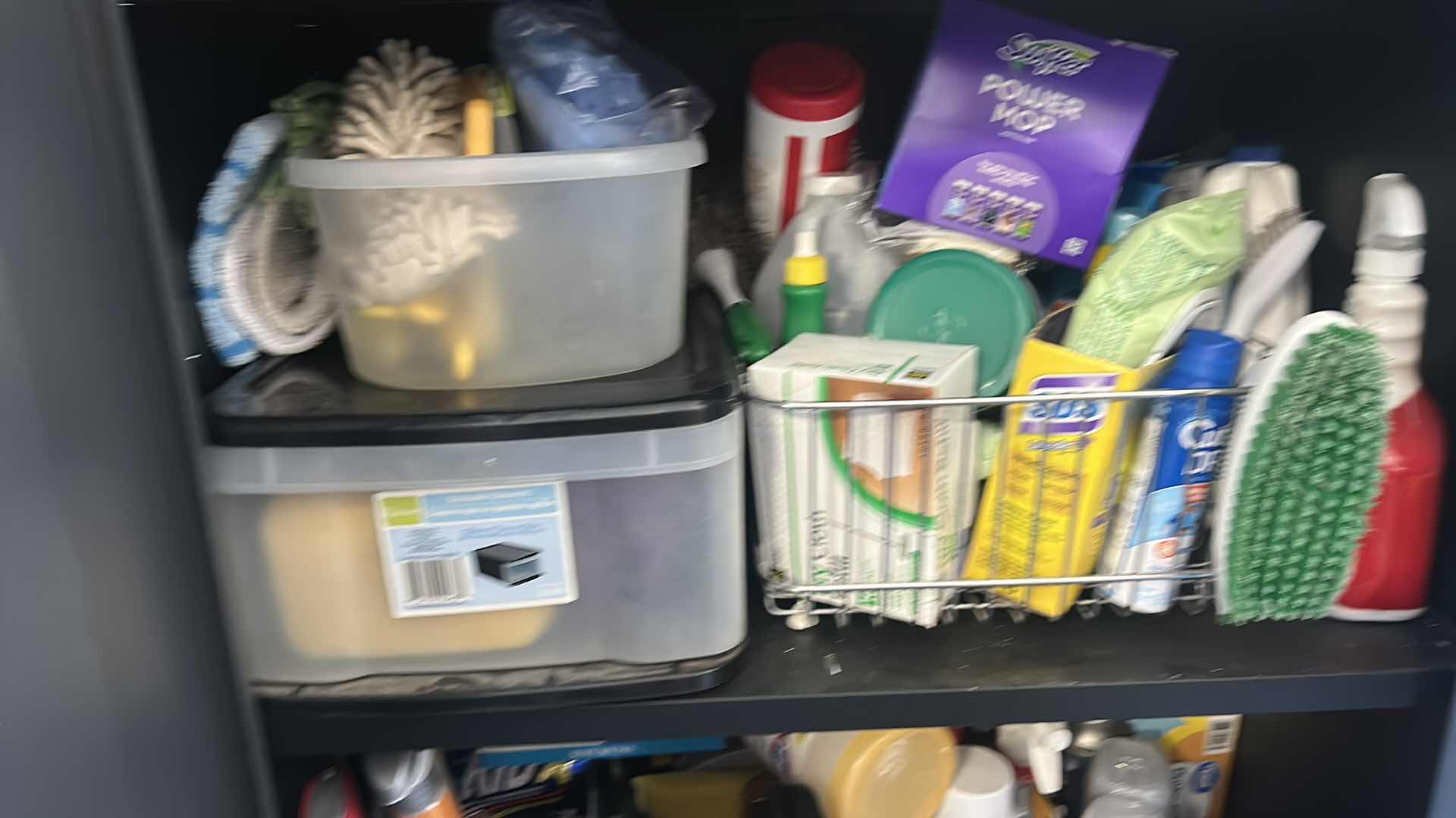 Photo 1 of CLEANING SUPPLIES ON SHELVES IN CABINET