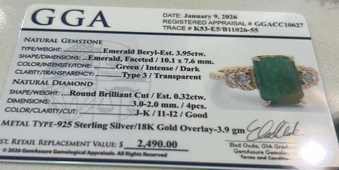 Photo 1 of 925 STERLING SILVER W 18K GOLD OVERLAY EMERALD & DIAMOND RING
EMERALD APPROX 3.95 CTW AND DIAMONDS APPROX 0.32 CTW
GGA CERTIFIED, EST SIZE 7.5 -RN040653