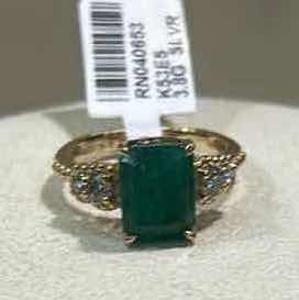 Photo 1 of 925 STERLING SILVER W 18K GOLD OVERLAY EMERALD & DIAMOND RING
EMERALD APPROX 3.95 CTW AND DIAMONDS APPROX 0.32 CTW
GGA CERTIFIED, EST SIZE 7.5 -RN040653