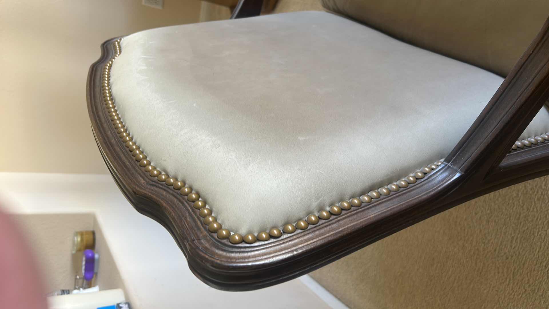 Photo 1 of LOUIS XV-STYLE BERGÈRE CHAIR WITH DARK WOOD FRAME AND LIGHT-COLORED LEATHER OR SUEDE UPHOLSTERY. 31“ x 29“ x H35“