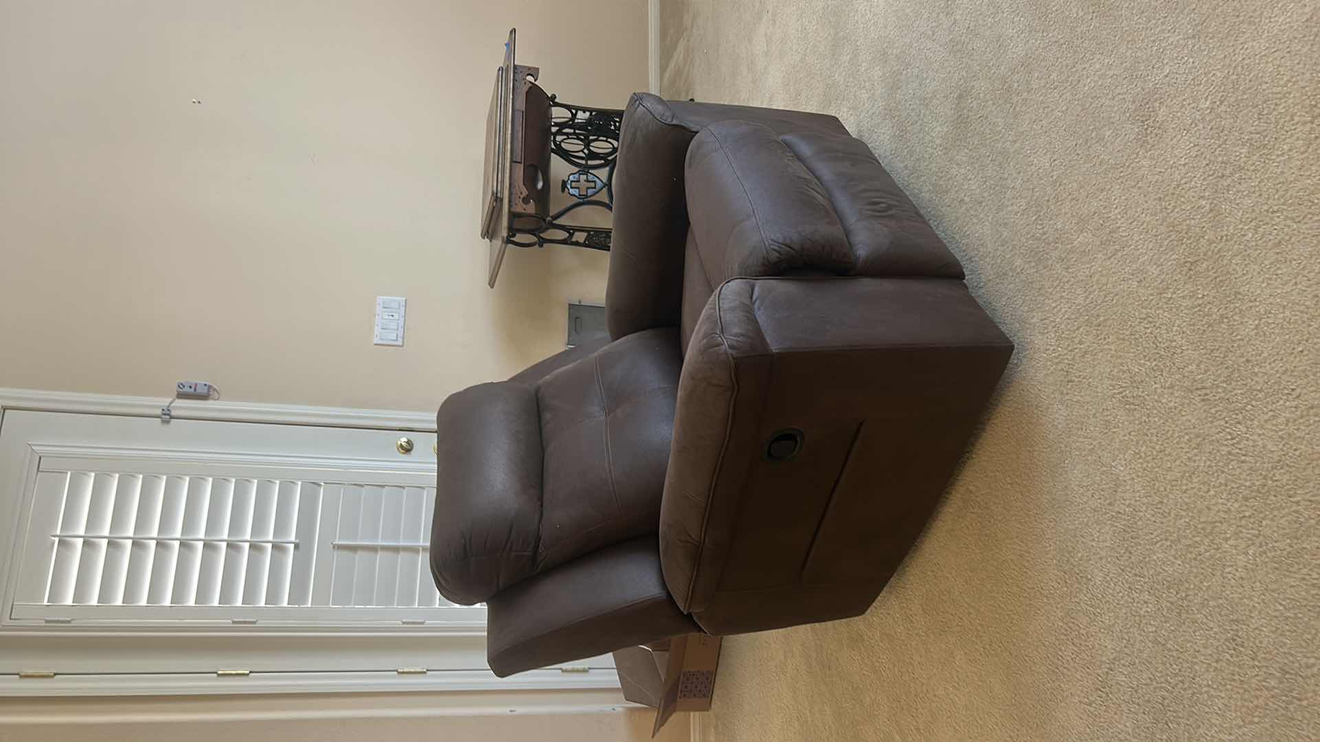 Photo 1 of ASHLEY FURNITURE ROCKER RECLINER WITH LEATHER-LOOK UPHOLSTERY. MADE OF POLYURETHANE, POLYESTER, AND FIBER MATERIALS.