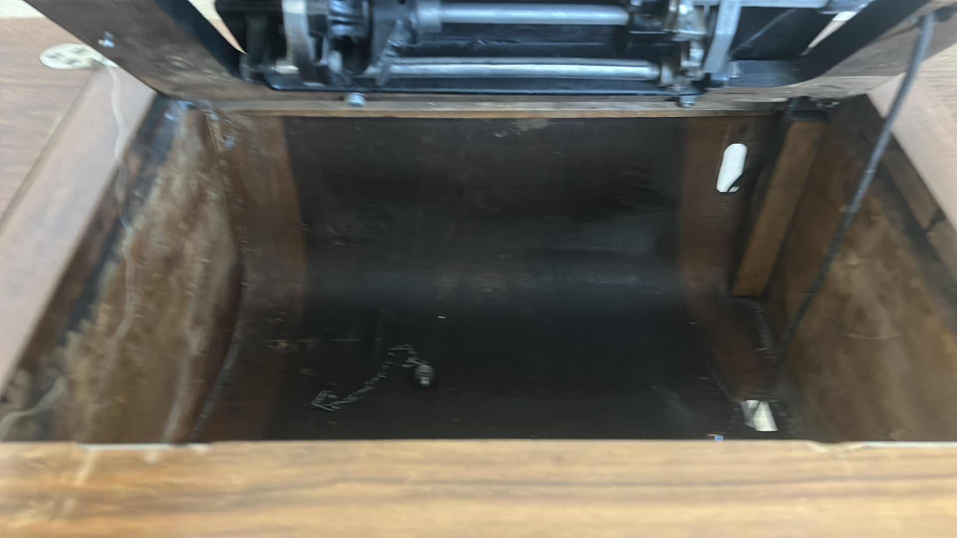Photo 1 of ANTIQUE HELVETIA TREADLE SEWING MACHINE AND CABINET, ORNATE CAST IRON AND GOLD DETAILING PLUS PARTS. INCLUDES CAST IRON TREADLE BASE, SEWING MACHINE HEAD, WOOD TABLE TOP, DRAWERS, AND LOOSE WOOD COMPONENTS.
36 1/2“ x 18 1/2“ x H32“