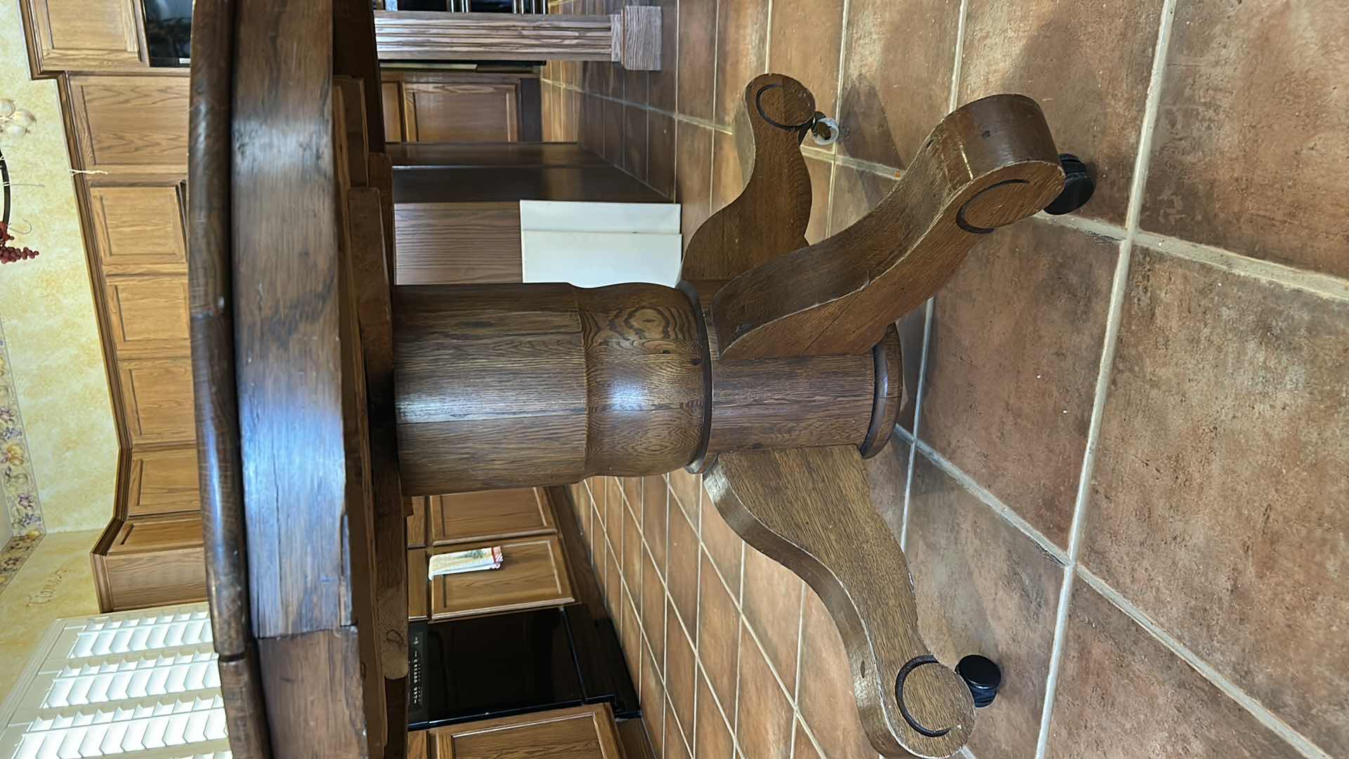 Photo 1 of ANTIQUE OAK ROUND PEDESTAL DINING TABLE ON CASTERS. 43 1/2“ x H30 1/2“ PLUS 3 9.5” LEAFS