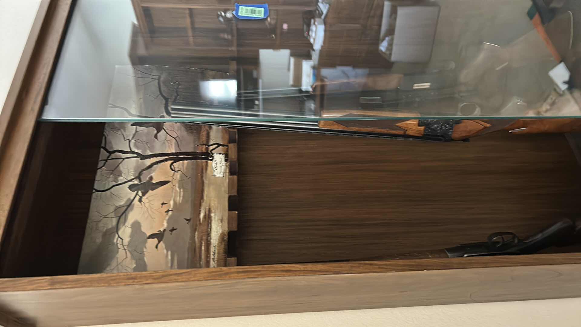 Photo 1 of WOODEN GUN CABINET WITH GLASS FRONT. FEATURES CARVED WOOD DOORS ON LOWER CABINET AND LOCKING STORAGE. DESIGNED TO DISPLAY AND STORE FIREARMS. HOLDS 8, LOWER CABINET 33 1/4 x 16“ x H22“ , TOP CABINET 32“ x 10 1/2“ x H54 1/2“