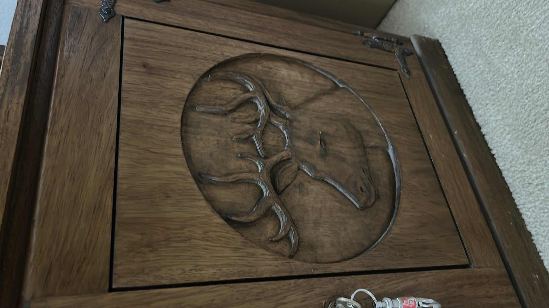 Photo 1 of WOODEN GUN CABINET WITH GLASS FRONT. FEATURES CARVED WOOD DOORS ON LOWER CABINET AND LOCKING STORAGE. DESIGNED TO DISPLAY AND STORE FIREARMS. HOLDS 8, LOWER CABINET 33 1/4 x 16“ x H22“ , TOP CABINET 32“ x 10 1/2“ x H54 1/2“