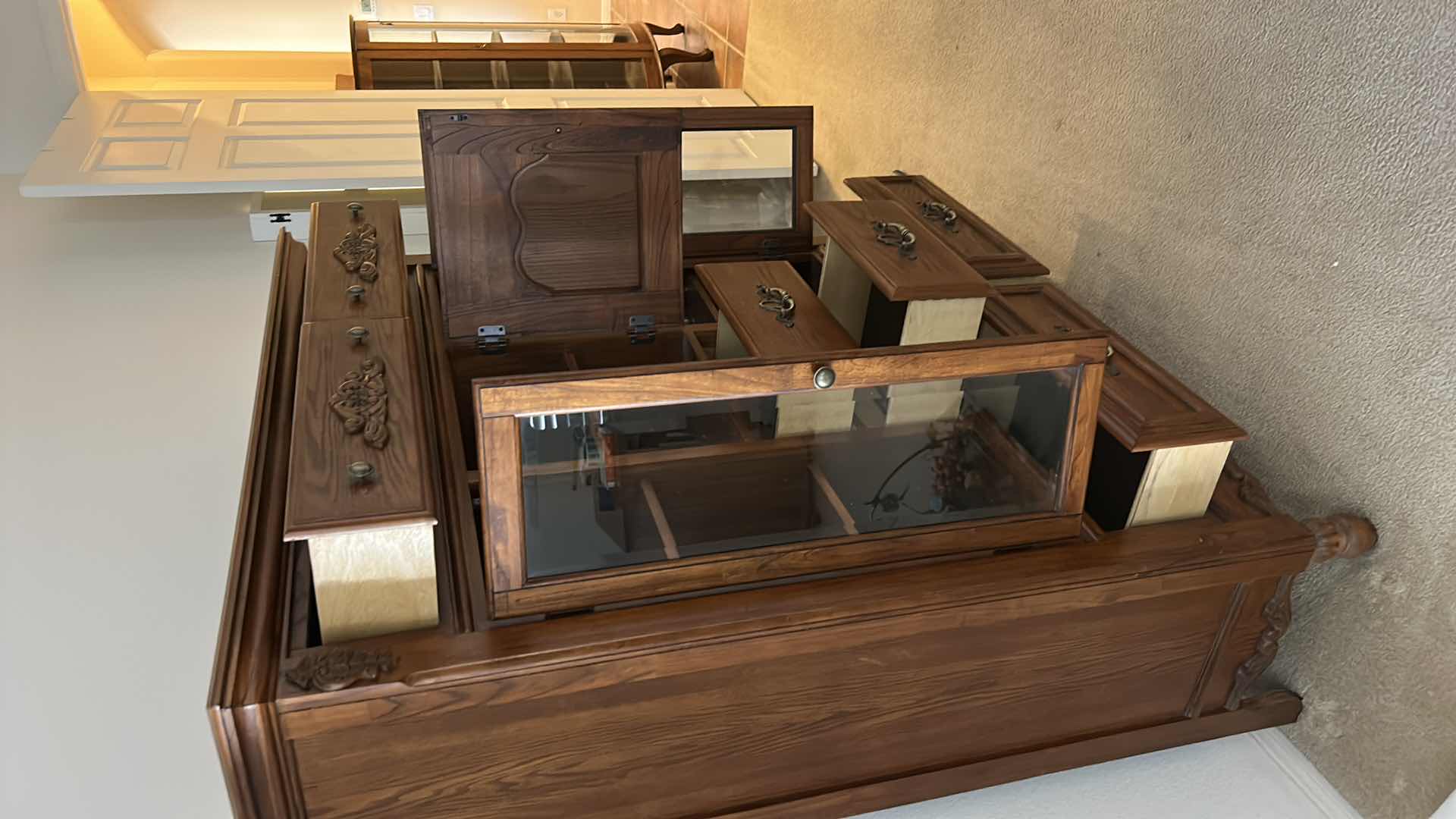 Photo 1 of TRADITIONAL CARVED WOOD HUTCH OR ARMOIRE, OFTEN REFERRED TO AS A CHINA CABINET. FEATURES DARK CHERRY OR WALNUT FINISH WITH GLASS-PANELED DOORS AND DRAWERS FOR STORAGE. 54 1/2” x 19” x H65” TONGUE AND GROOVE