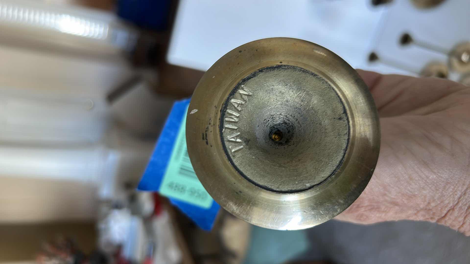 Photo 1 of BRASS CANDLE HOLDERS AND CANDLE ACCESSORIES. INCLUDES MULTIPLE TALL TAPER HOLDERS, A MULTI-ARM CANDELABRA H10” AND A BRASS CUP.