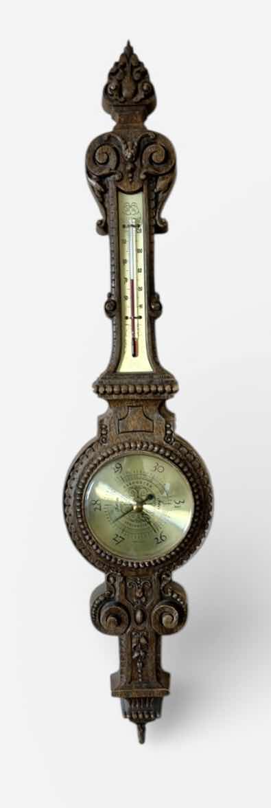 Photo 1 of ANTIQUE STYLE WALL-MOUNTED BAROMETER AND THERMOMETER. ORNATE DECORATIVE FRAME WITH ROUND DIAL AND VERTICAL TEMPERATURE GAUGE. RESIN H30’