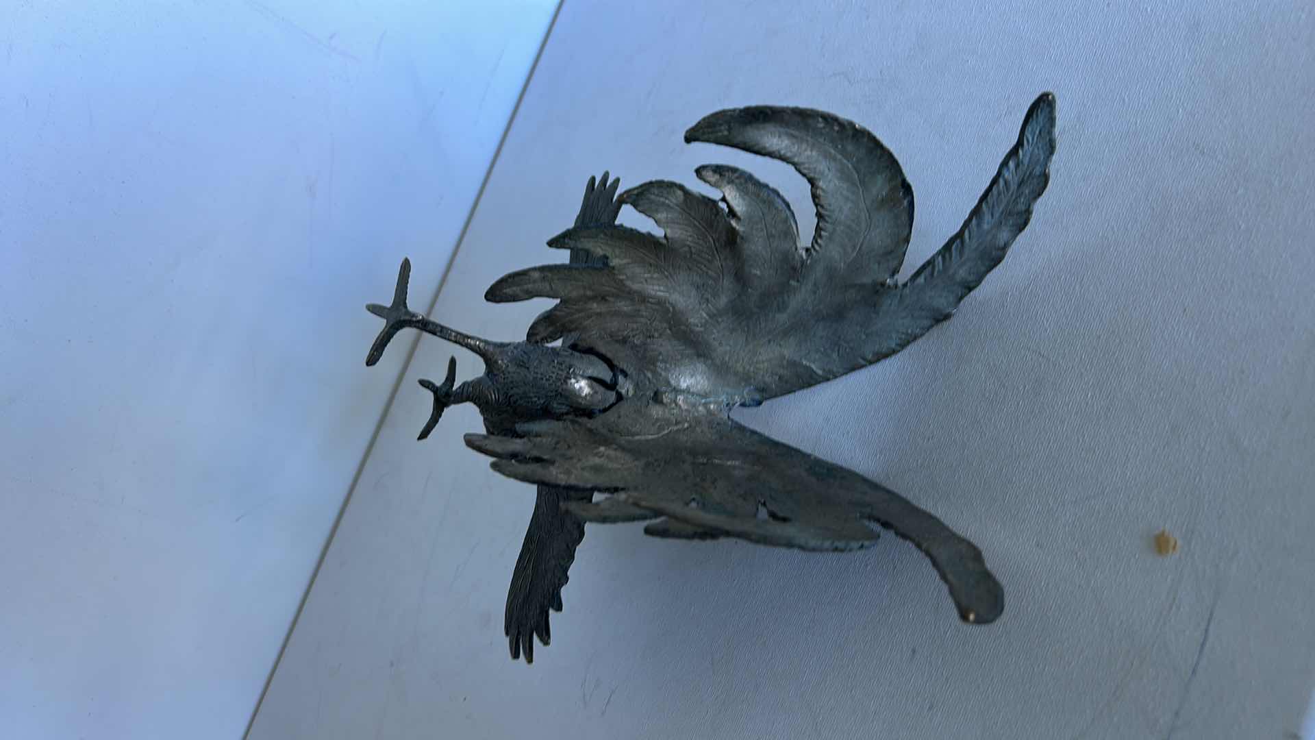 Photo 1 of DECORATIVE METAL ROOSTER FIGURINE WITH DETAILED FEATHER DESIGN. 9” x H4 1/2”