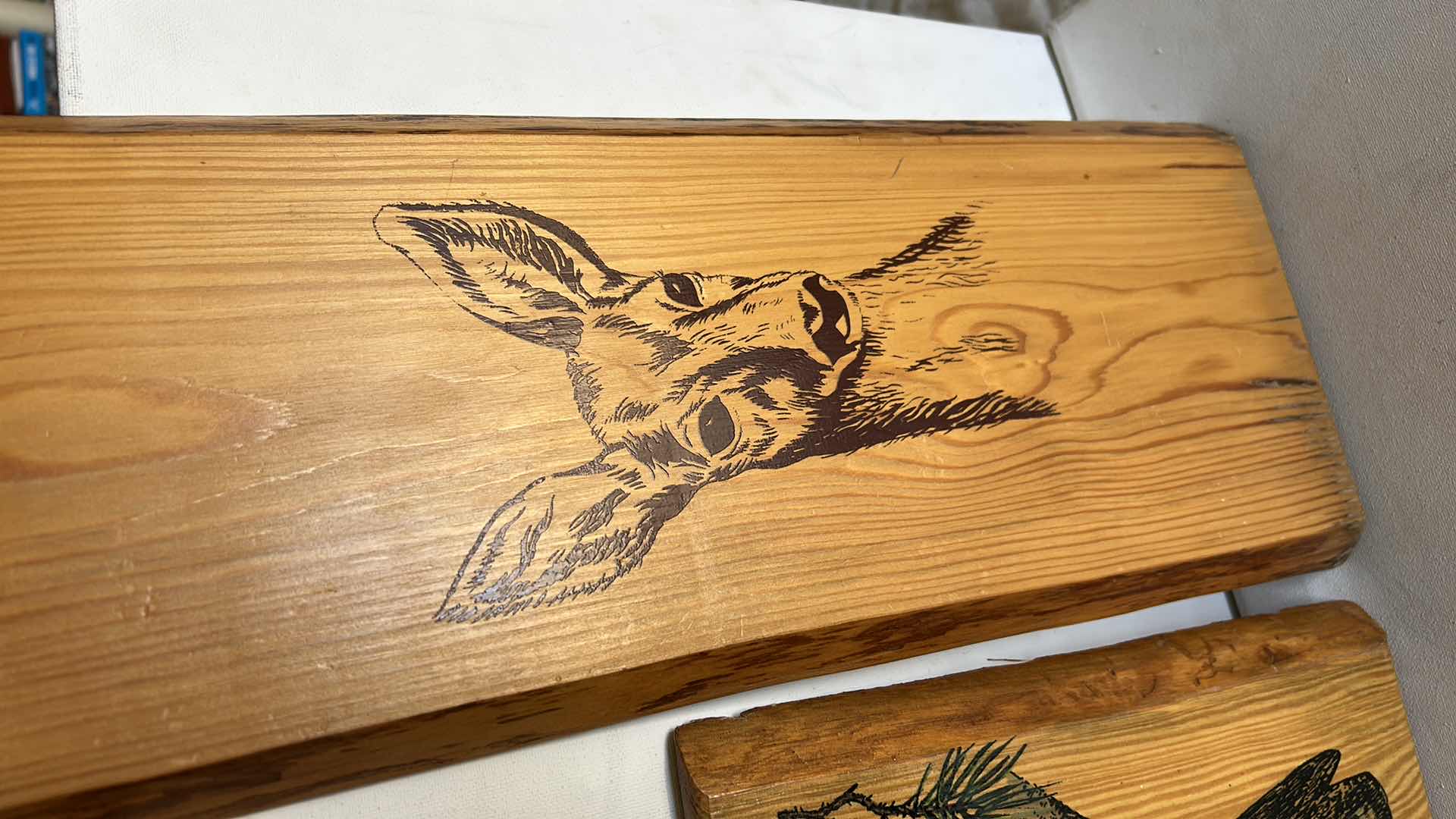 Photo 1 of SET OF TWO WOOD DECORATIVE PLAQUES. FEATURE PRINTED WILDLIFE ARTWORK,INCLUDING A BIRD AND A DEER. NATURAL WOOD FINISH (TALLEST H18”)