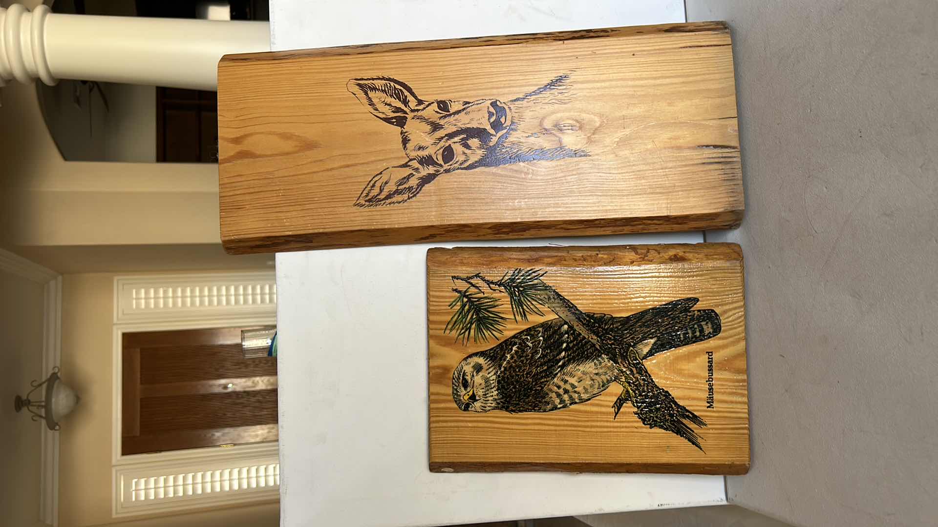 Photo 1 of SET OF TWO WOOD DECORATIVE PLAQUES. FEATURE PRINTED WILDLIFE ARTWORK,INCLUDING A BIRD AND A DEER. NATURAL WOOD FINISH (TALLEST H18”)