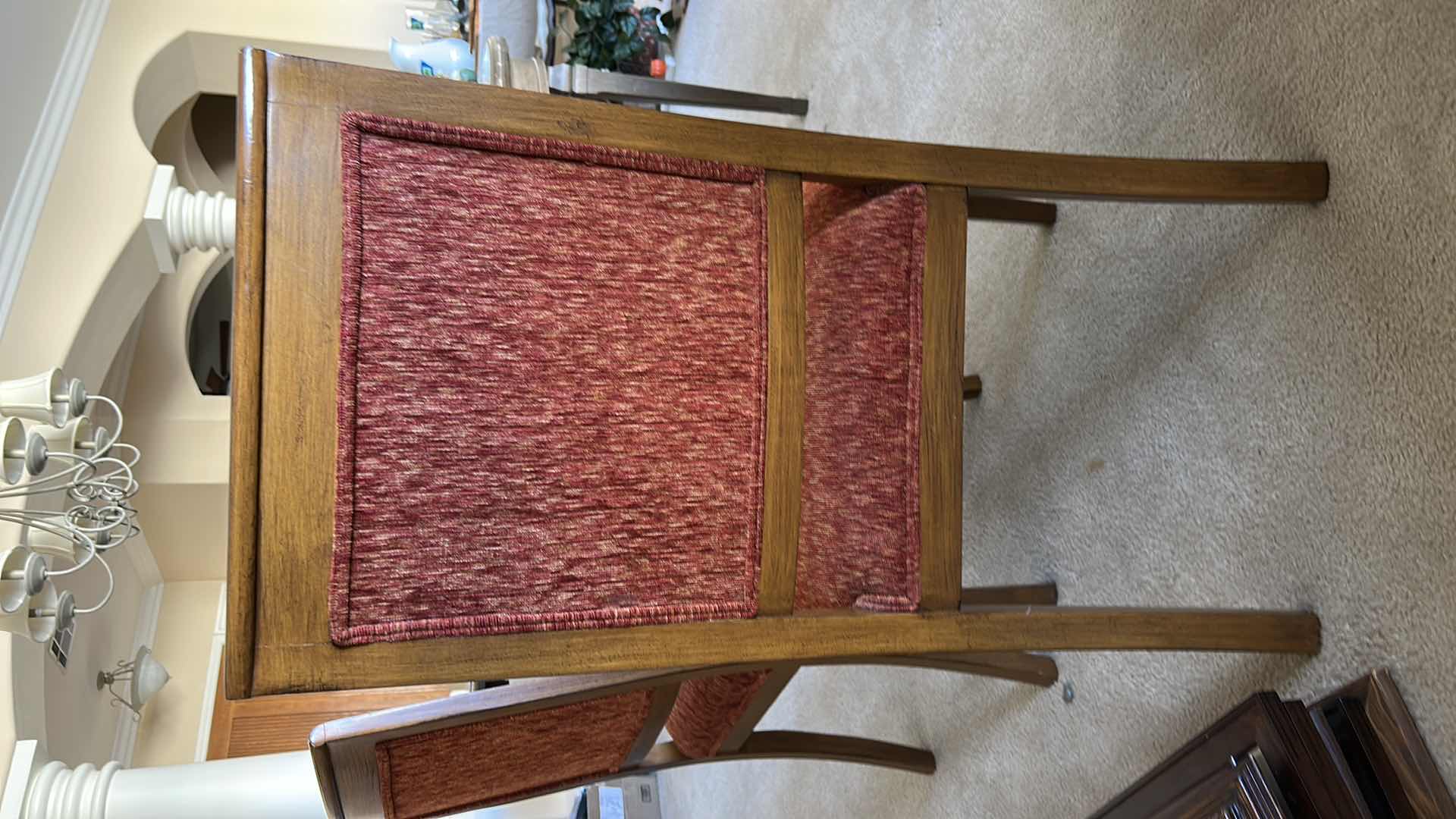 Photo 1 of SET OF TWO WOODEN SIDE CHAIRS WITH UPHOLSTERED SEATS AND BACKS. WOOD FRAMES WITH RED FABRIC CUSHIONS. SUITABLE FOR DINING OR ACCENT SEATING.