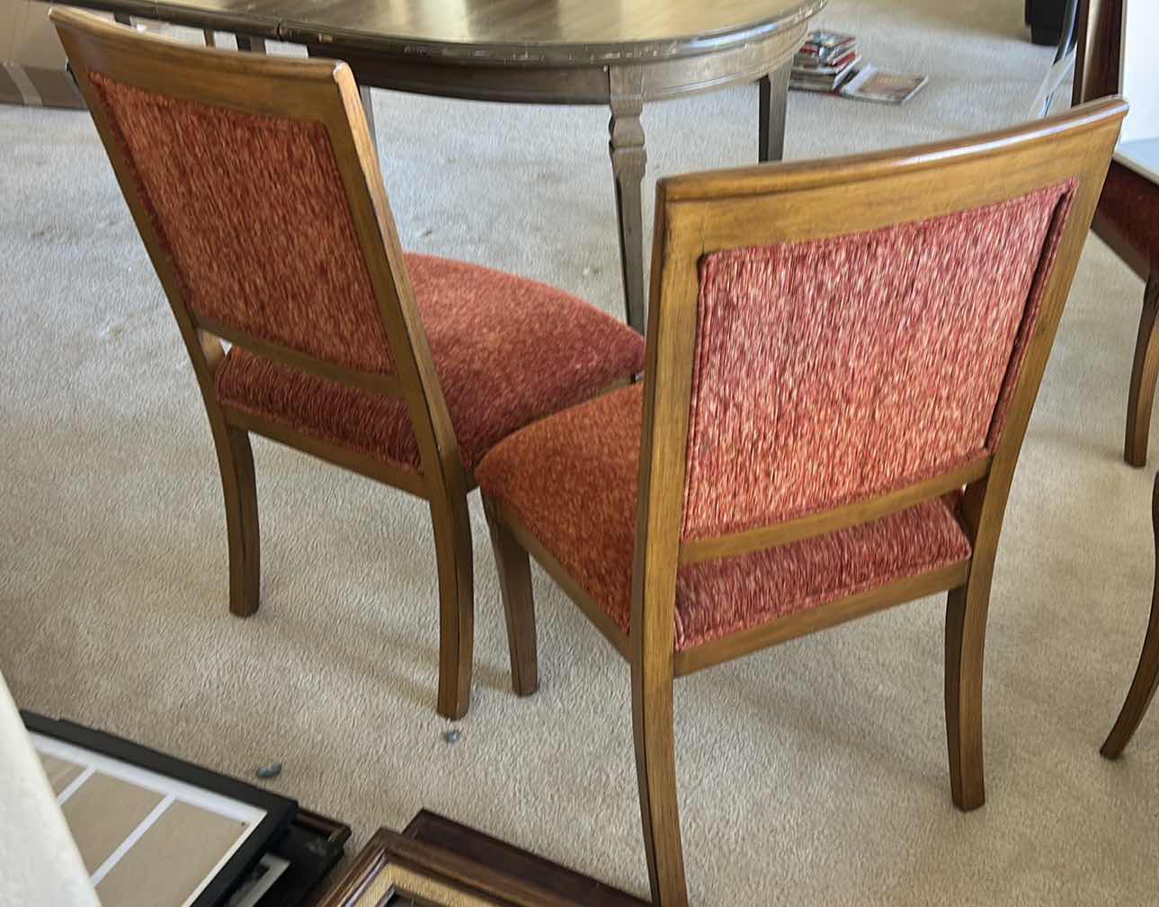 Photo 1 of SET OF TWO WOODEN SIDE CHAIRS WITH UPHOLSTERED SEATS AND BACKS. WOOD FRAMES WITH RED FABRIC CUSHIONS. SUITABLE FOR DINING OR ACCENT SEATING.