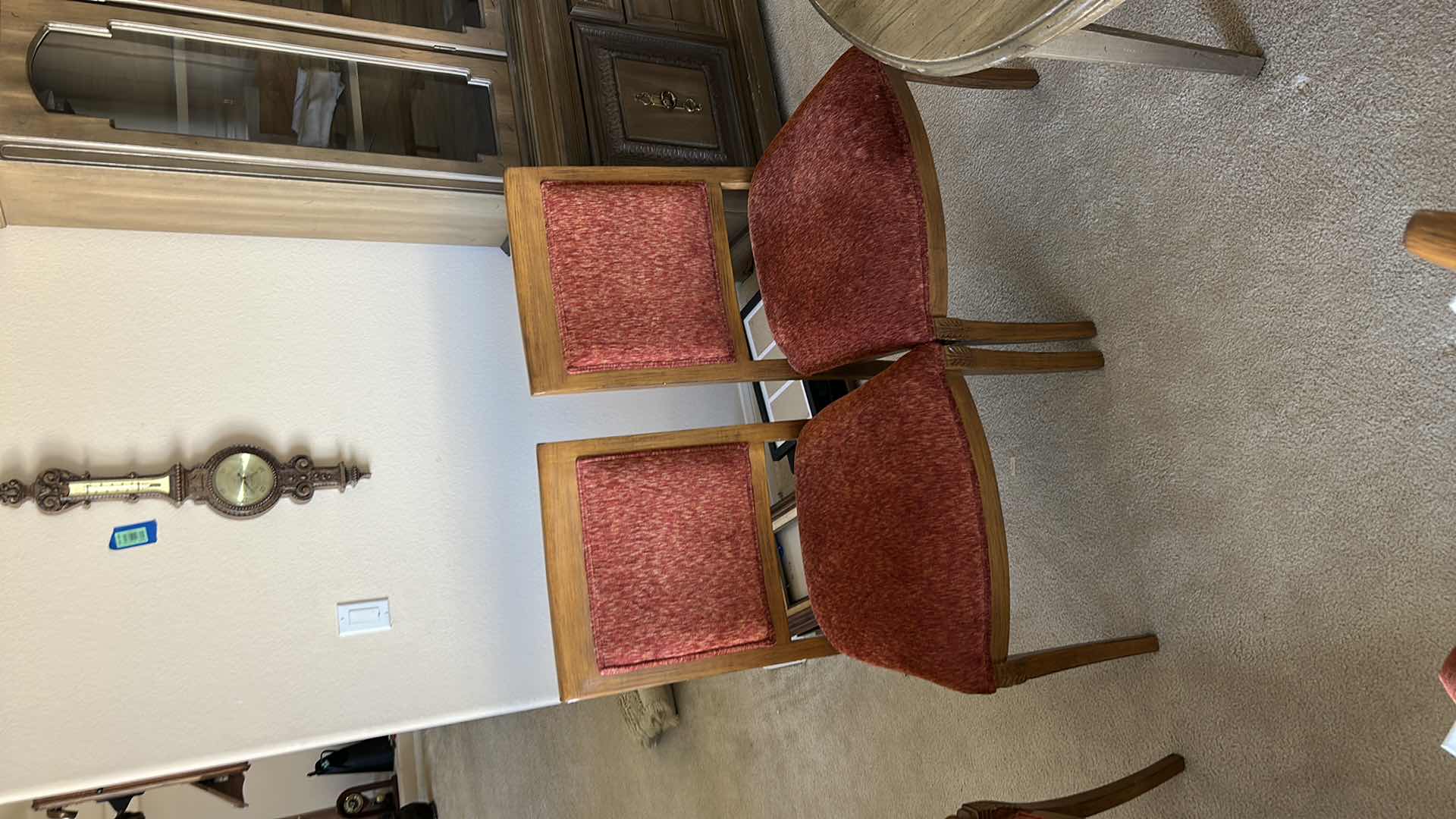 Photo 1 of SET OF TWO WOODEN SIDE CHAIRS WITH UPHOLSTERED SEATS AND BACKS. WOOD FRAMES WITH RED FABRIC CUSHIONS. SUITABLE FOR DINING OR ACCENT SEATING.