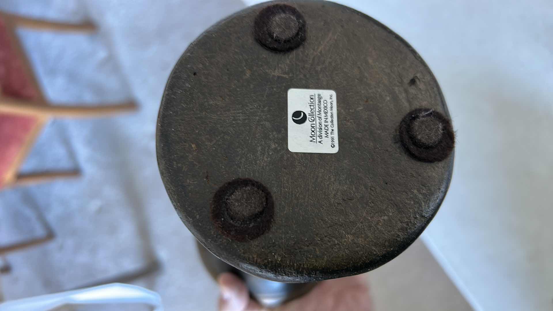 Photo 1 of SET OF THREE DECORATIVE PILLAR CANDLE HOLDERS. MADE OF HEAVY POTTERY WITH A DARK BRONZE-TONE FINISH AND TEXTURED DESIGN. EACH HOLDS A PILLAR-STYLE CANDLE. (TALLEST H13”)