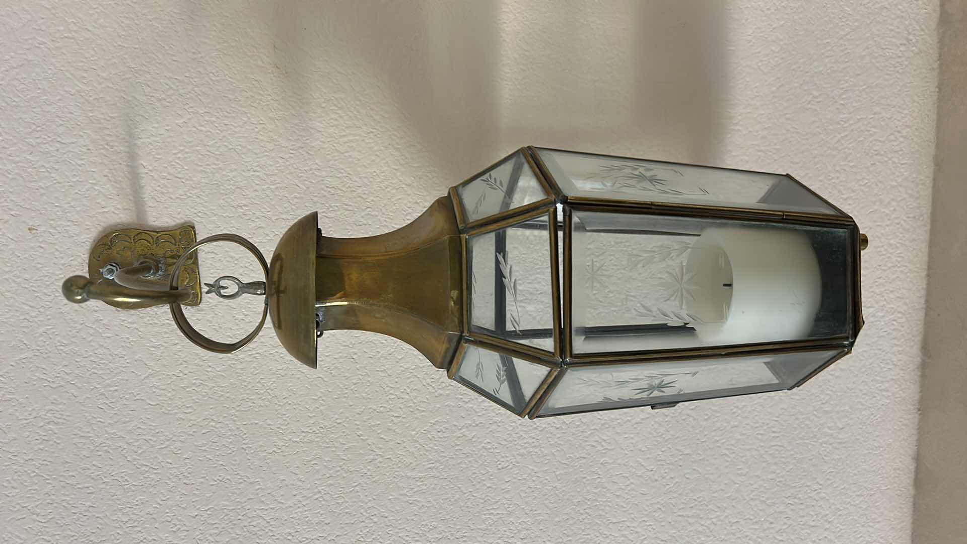 Photo 1 of 2 VINTAGE STYLE WALL-MOUNTED BRASS AND GLASS LANTERN. FEATURES ETCHED GLASS PANELS. (H20” FROM WALL HOOK TO BOTTOM)