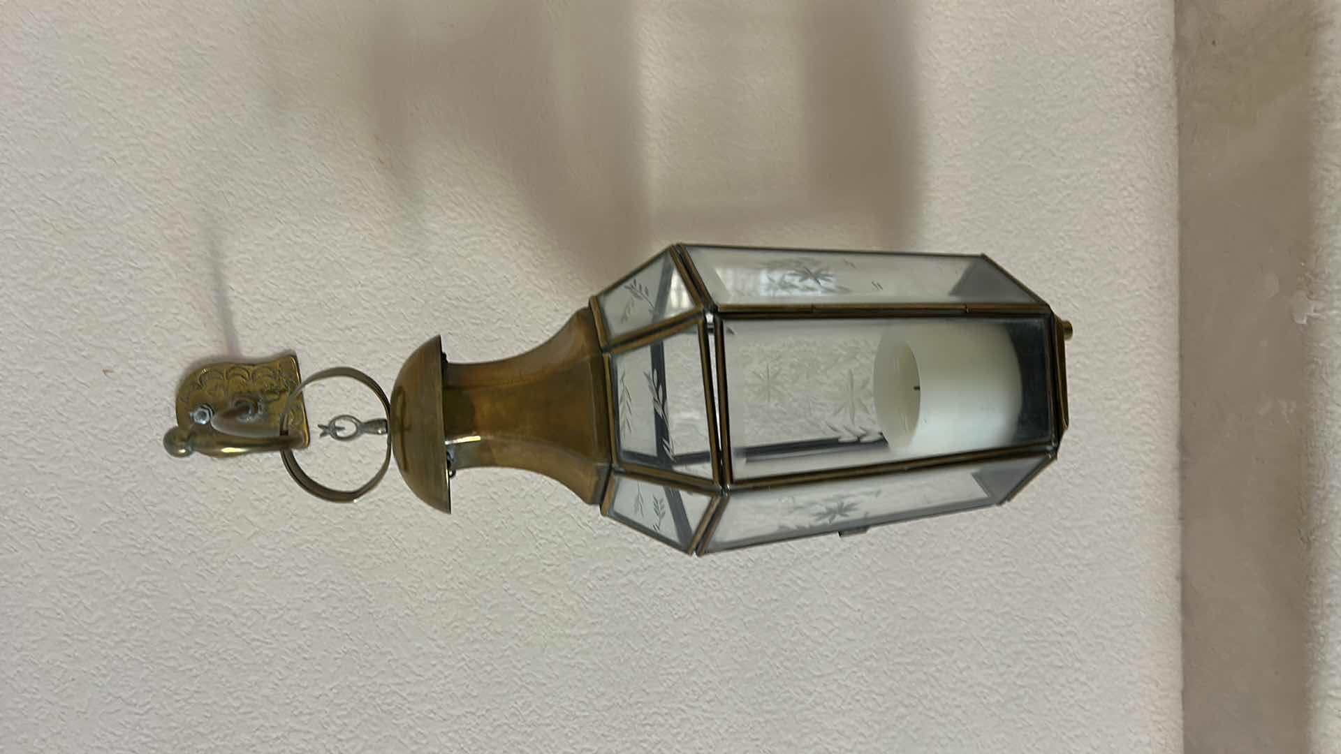 Photo 1 of 2 VINTAGE STYLE WALL-MOUNTED BRASS AND GLASS LANTERN. FEATURES ETCHED GLASS PANELS. (H20” FROM WALL HOOK TO BOTTOM)