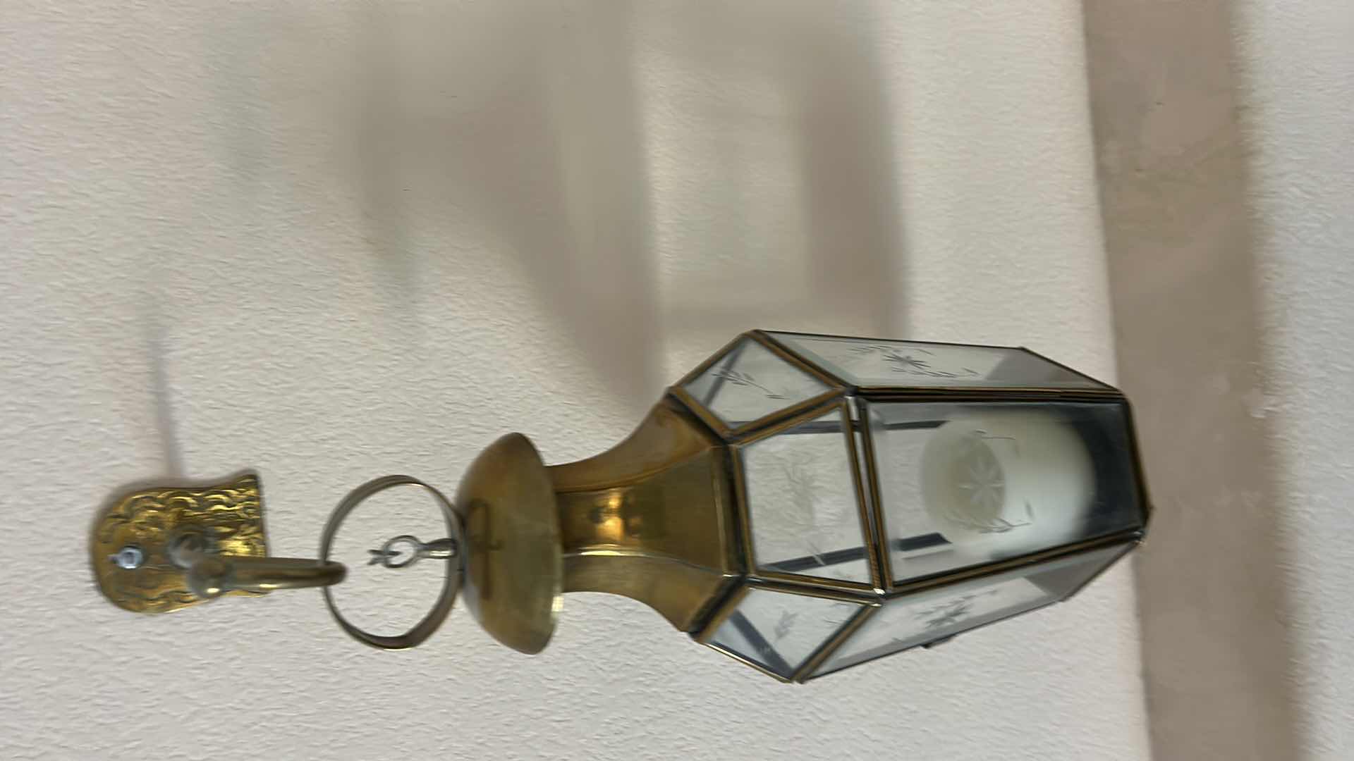 Photo 1 of 2 VINTAGE STYLE WALL-MOUNTED BRASS AND GLASS LANTERN. FEATURES ETCHED GLASS PANELS. (H20” FROM WALL HOOK TO BOTTOM)