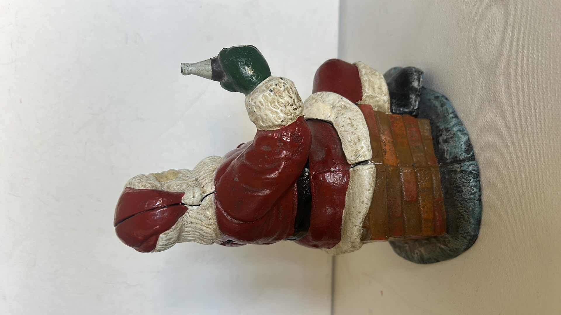 Photo 1 of CAST IRON VINTAGE SANTA CLAUSE HOLDING COCA COLA H8”