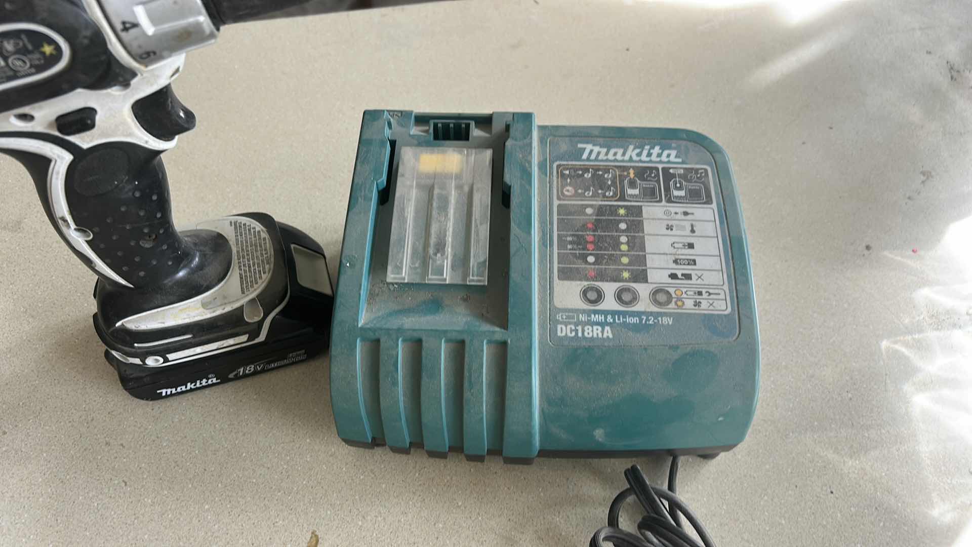 Photo 1 of MAKITA CORDLESS DRILL / DRIVER WITH BATTERY AND MAKITA BATTERY CHARGER.