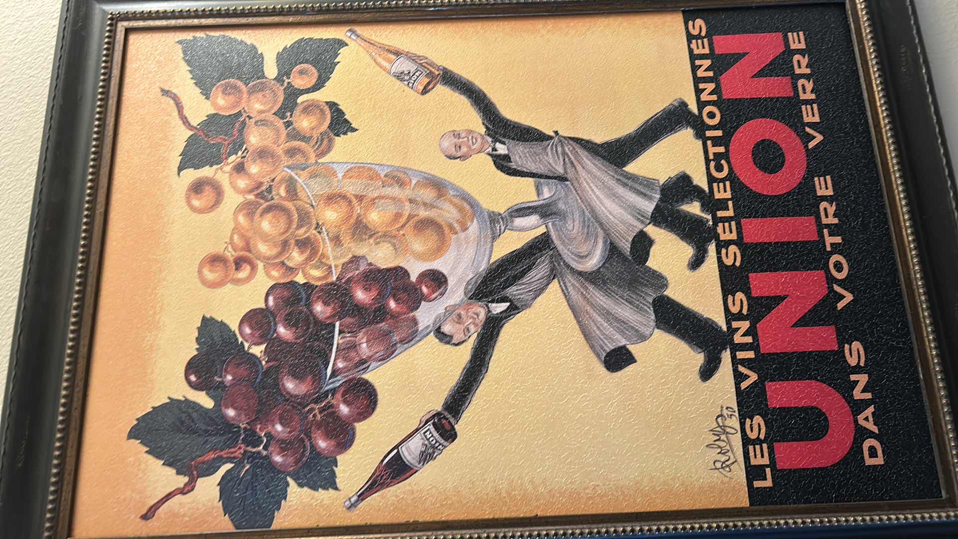 Photo 1 of FRAMED VINTAGE SIGNED ADVERTISEMENT TITLED “LES VINS SELECTIONNES UNION DANS VOTRE VERRE,” DESIGNED BY ROBERT WOLFF. 30” x H42”