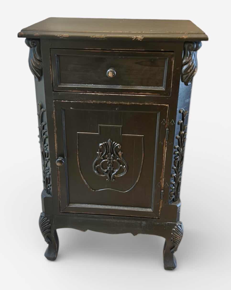 Photo 1 of WOOD ACCENT CABINET WITH SINGLE DRAWER AND DOOR, FEATURING ORNATE APPLIED SCROLL DETAILS, SHIELD-FRONT PANEL, AND CURVED FEET. 19 1/2“ x 12 1/2“ x H32 1/2“