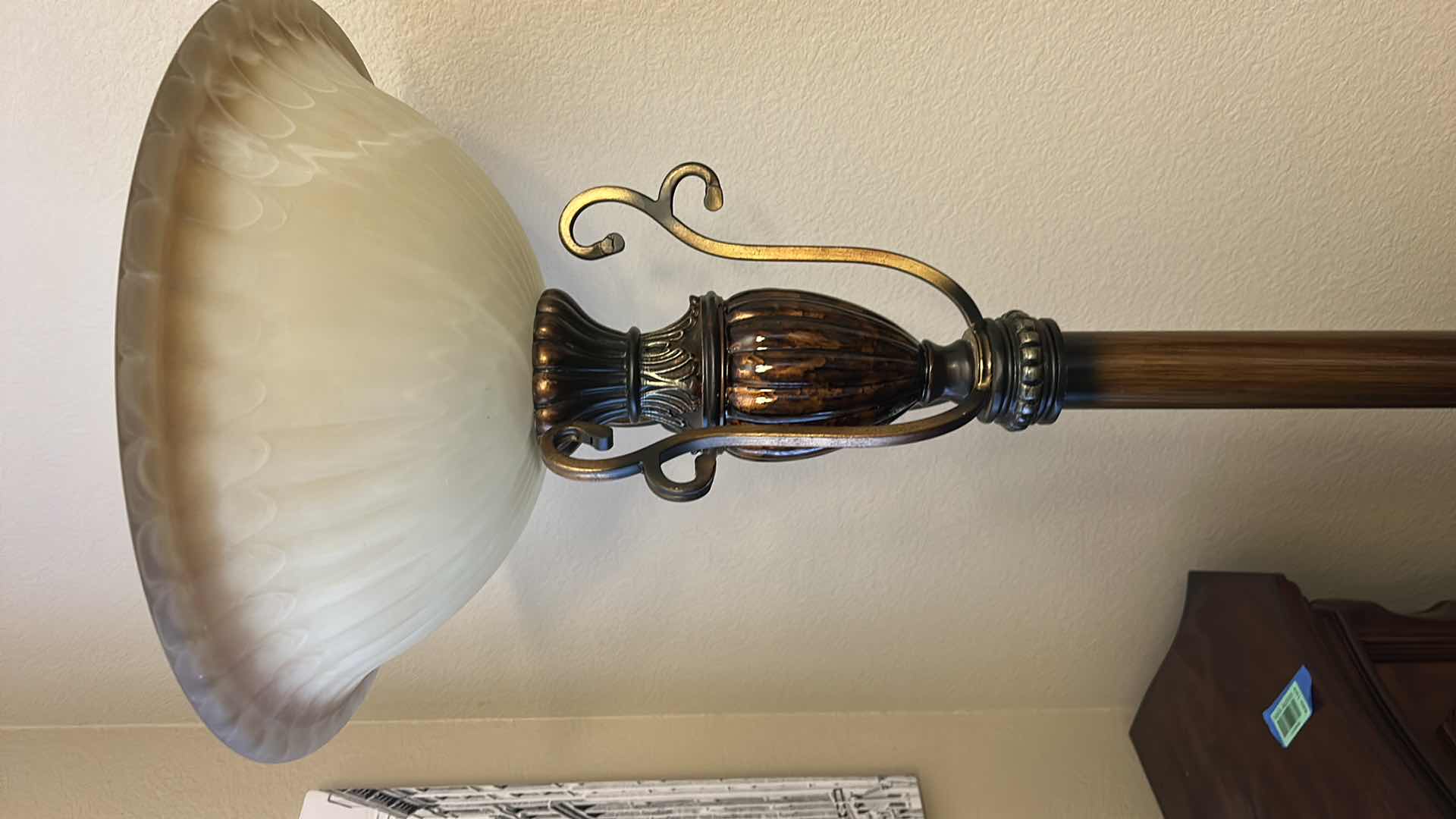 Photo 1 of VINTAGE-STYLE TORCHIERE FLOOR LAMP, FEATURING A TALL METAL BASE WITH A FAUX WOOD OR BRONZE FINISH AND AN UPWARD-FACING FROSTED GLASS BOWL SHADE. H 6’