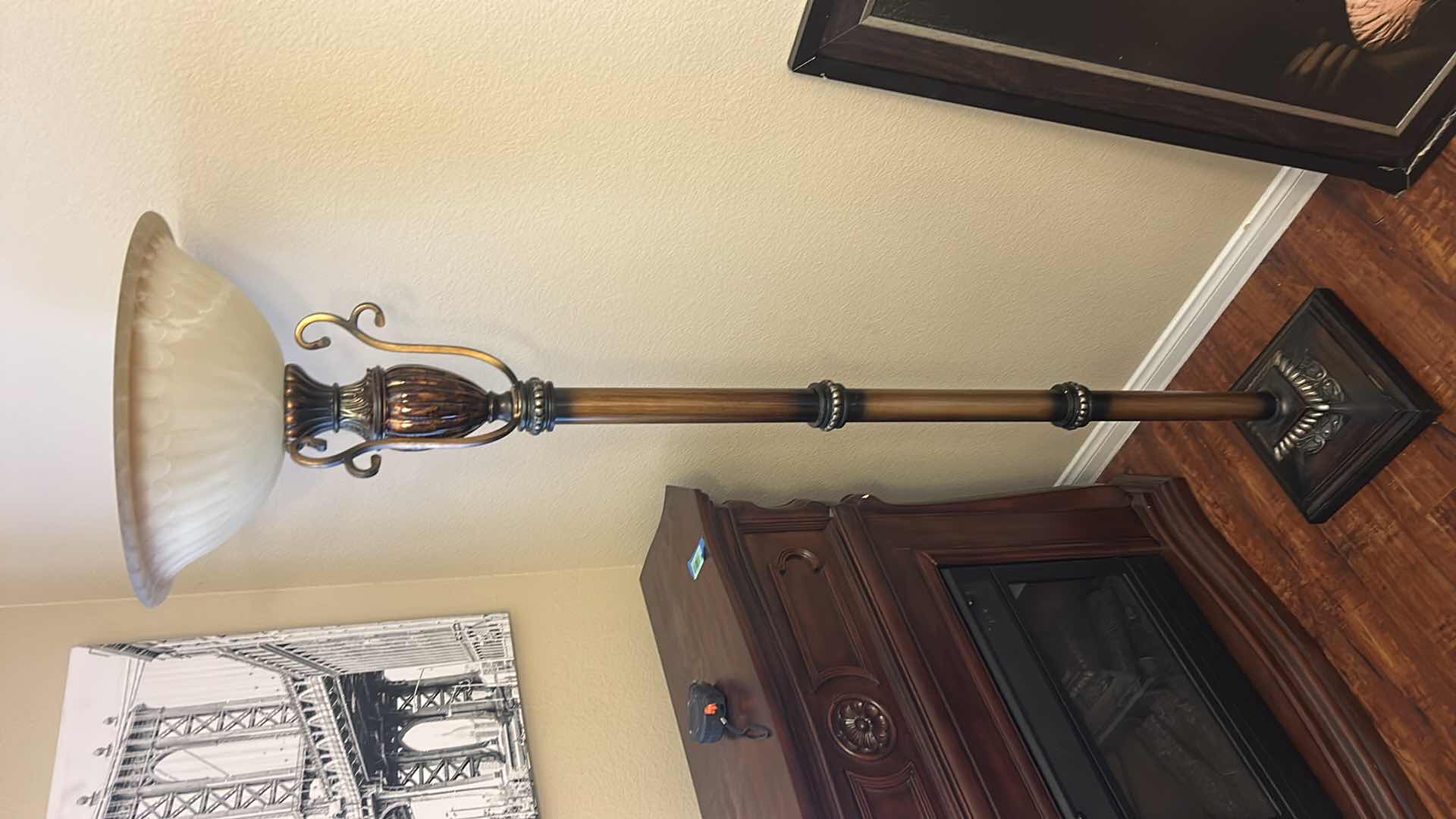 Photo 1 of VINTAGE-STYLE TORCHIERE FLOOR LAMP, FEATURING A TALL METAL BASE WITH A FAUX WOOD OR BRONZE FINISH AND AN UPWARD-FACING FROSTED GLASS BOWL SHADE. H 6’